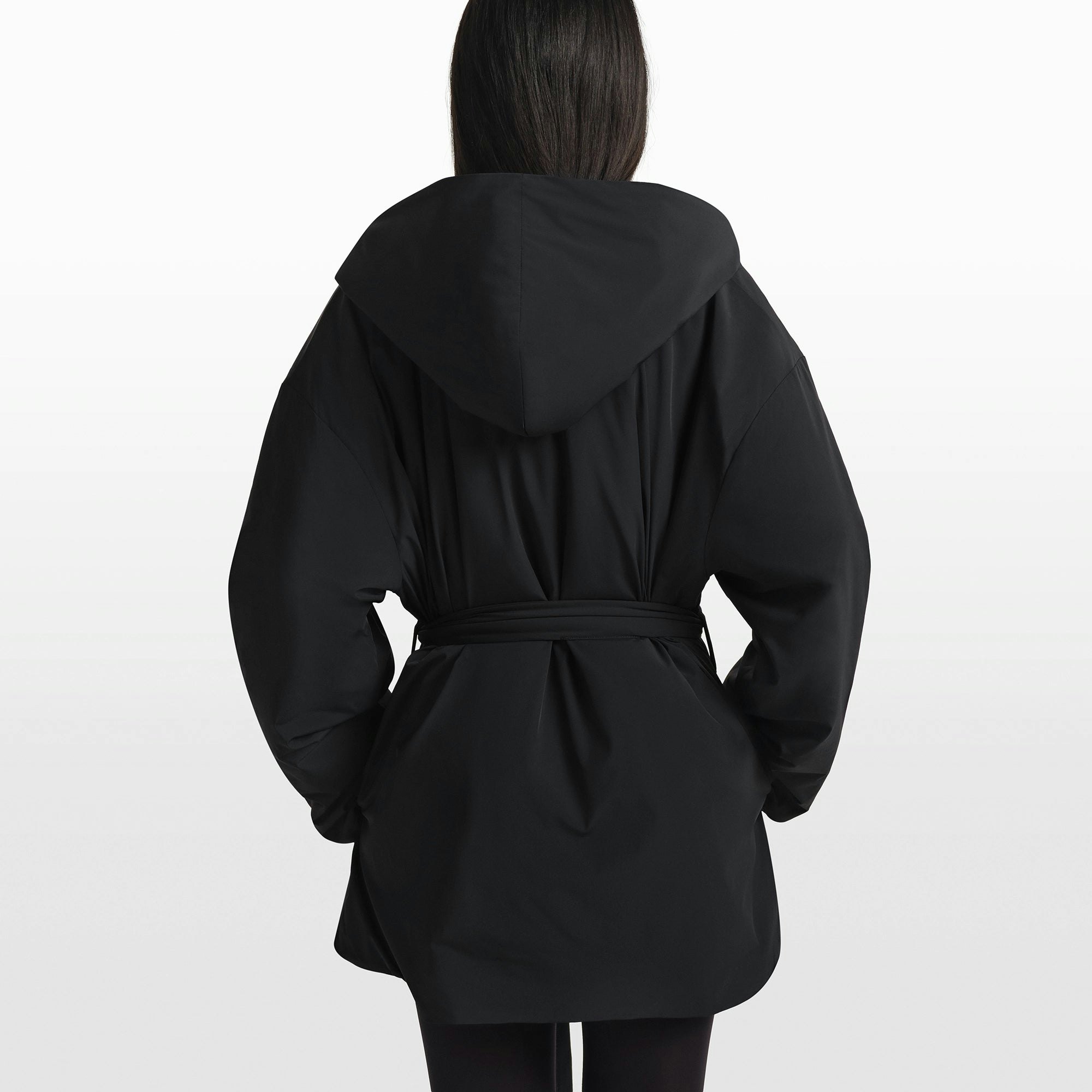 NikeSKIMS WOVEN NYLON WRAP COAT | OBSIDIAN ON A MODEL FRONT VIEW @ | FOCUS: 0.0, 1.0, 0.9