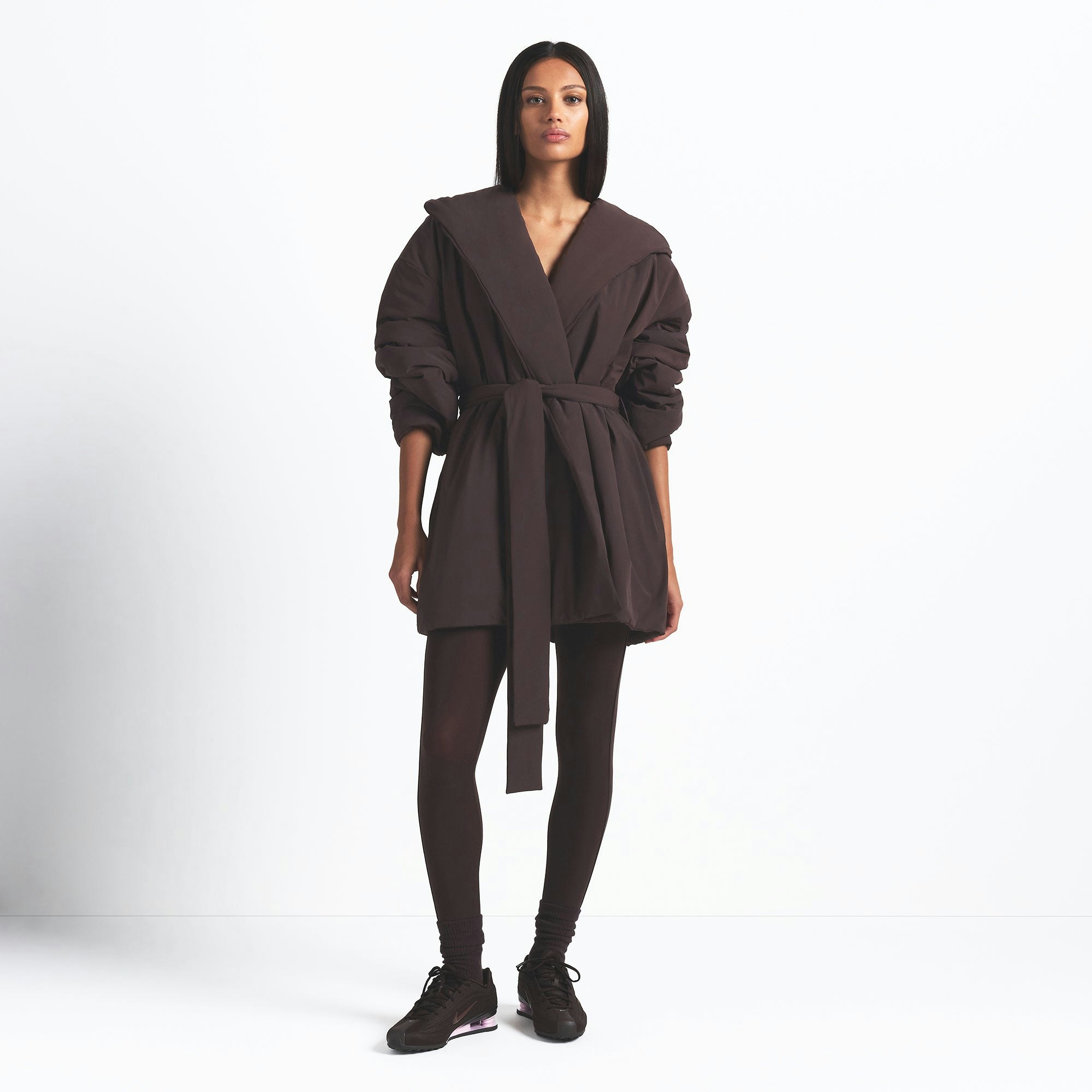 NikeSKIMS WOVEN NYLON WRAP COAT | PHOENIX ON A MODEL FRONT VIEW @ | FOCUS: 0.9, 0.1, 0.7