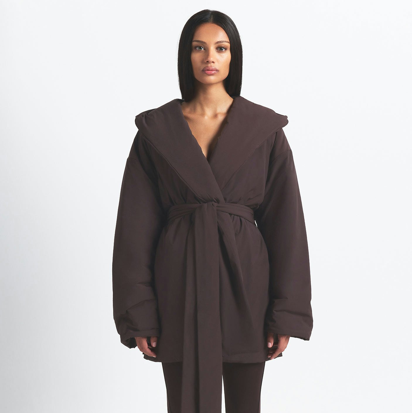 NikeSKIMS WOVEN NYLON WRAP COAT | PHOENIX ON A MODEL FRONT VIEW @ | FOCUS: 0.0, 1.0, 0.9