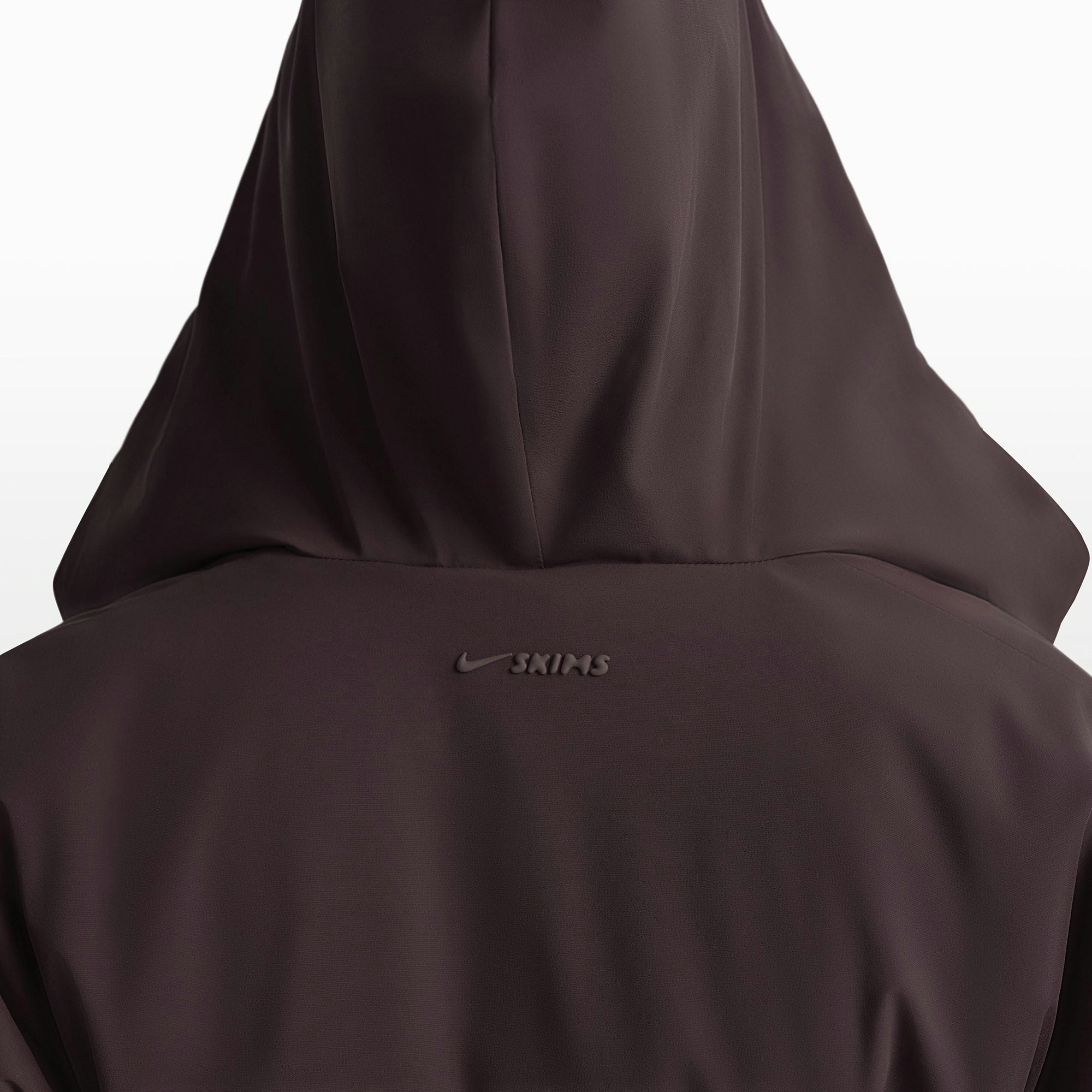 NikeSKIMS WOVEN NYLON WRAP COAT | PHOENIX ON A MODEL FRONT VIEW @ | FOCUS: 0.0, 1.0, 0.9