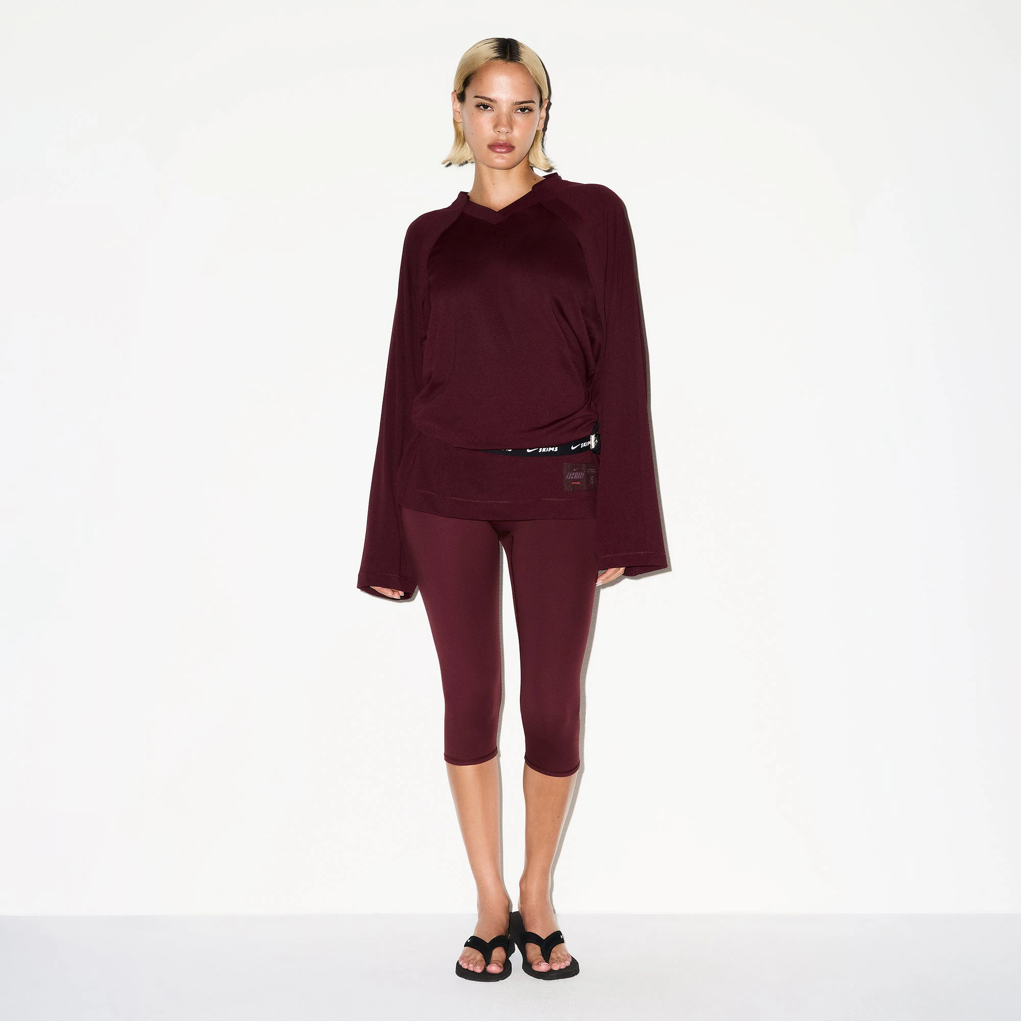 NikeSKIMS AIRY V-NECK OVERSIZED LONG SLEEVE TOP | CURRANT ON A MODEL FRONT VIEW @ | FOCUS: 0.0, 1.0, 0.9