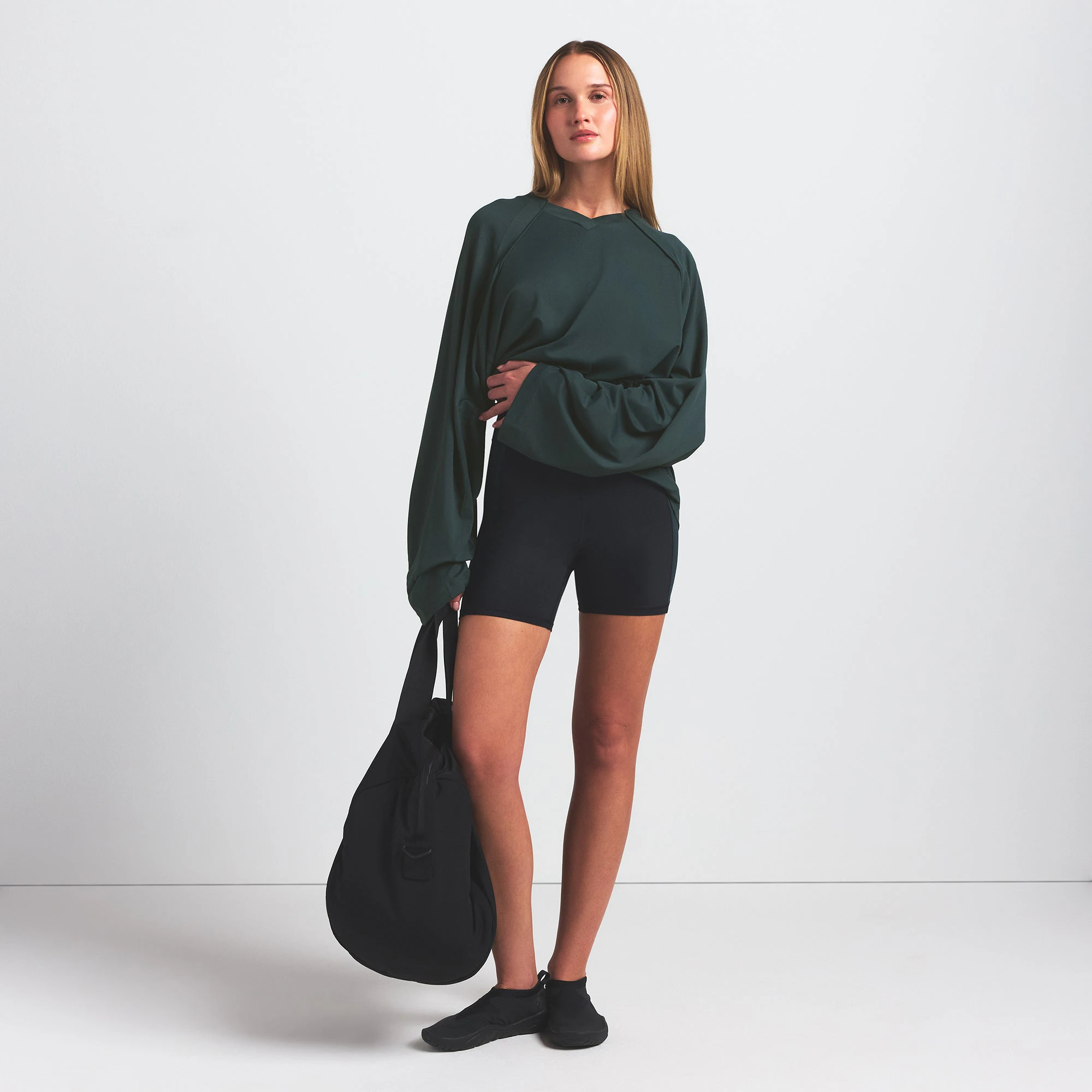 NikeSKIMS AIRY V-NECK OVERSIZED LONG SLEEVE TOP | DARK TEAL ON A MODEL FRONT VIEW @ | FOCUS: 0.0, 1.0, 0.9
