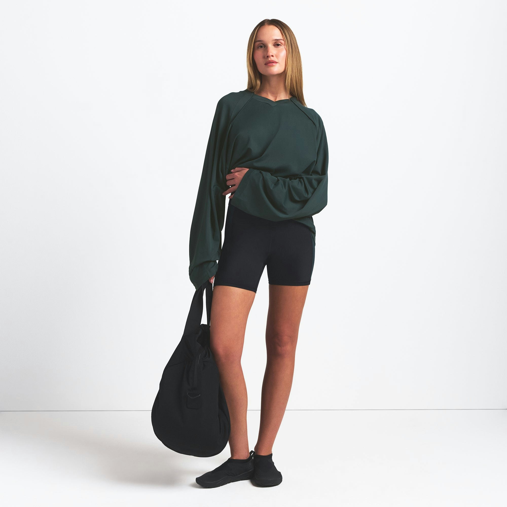 NikeSKIMS AIRY V-NECK OVERSIZED LONG SLEEVE TOP | DARK TEAL ON A MODEL FRONT VIEW @ | FOCUS: 0.0, 1.0, 0.9