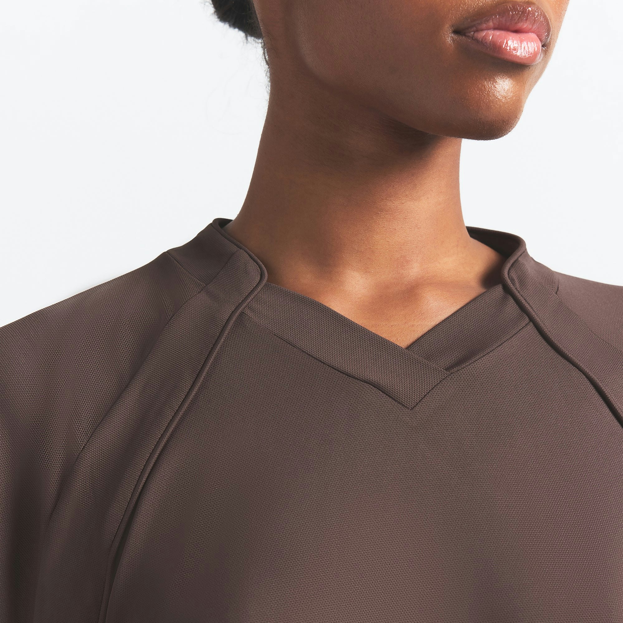 NikeSKIMS AIRY V-NECK OVERSIZED LONG SLEEVE TOP | DARK SEPIA ON A MODEL SIDE VIEW @ | FOCUS: 0.0, 1.0, 0.9
