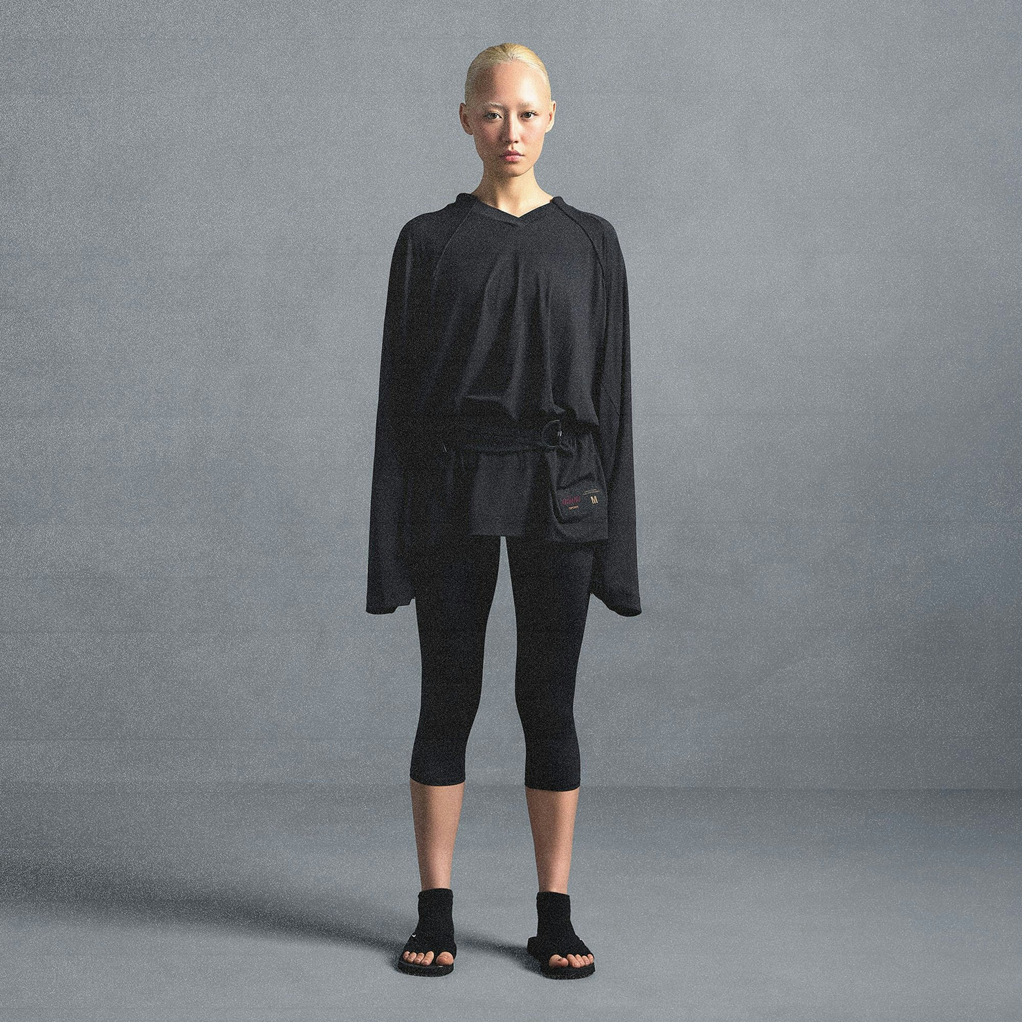 NikeSKIMS AIRY V-NECK OVERSIZED LONG SLEEVE TOP | OBSIDIAN ON A MODEL SIDE VIEW @ | FOCUS: 0.0, 1.0, 0.9