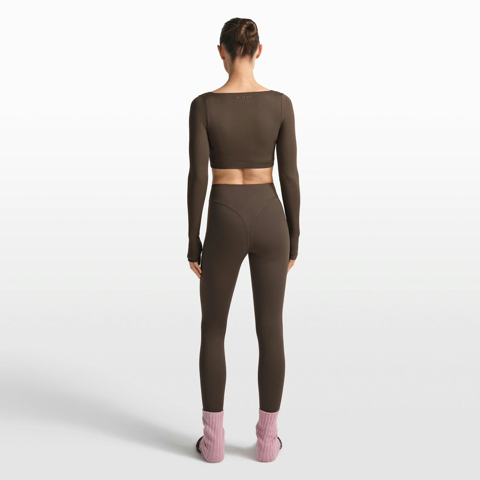NikeSKIMS MATTE WRAP LONG SLEEVE CROPPED TOP | DARK SEPIA ON A MODEL FRONT VIEW @ | FOCUS: 0.0, 1.0, 0.9