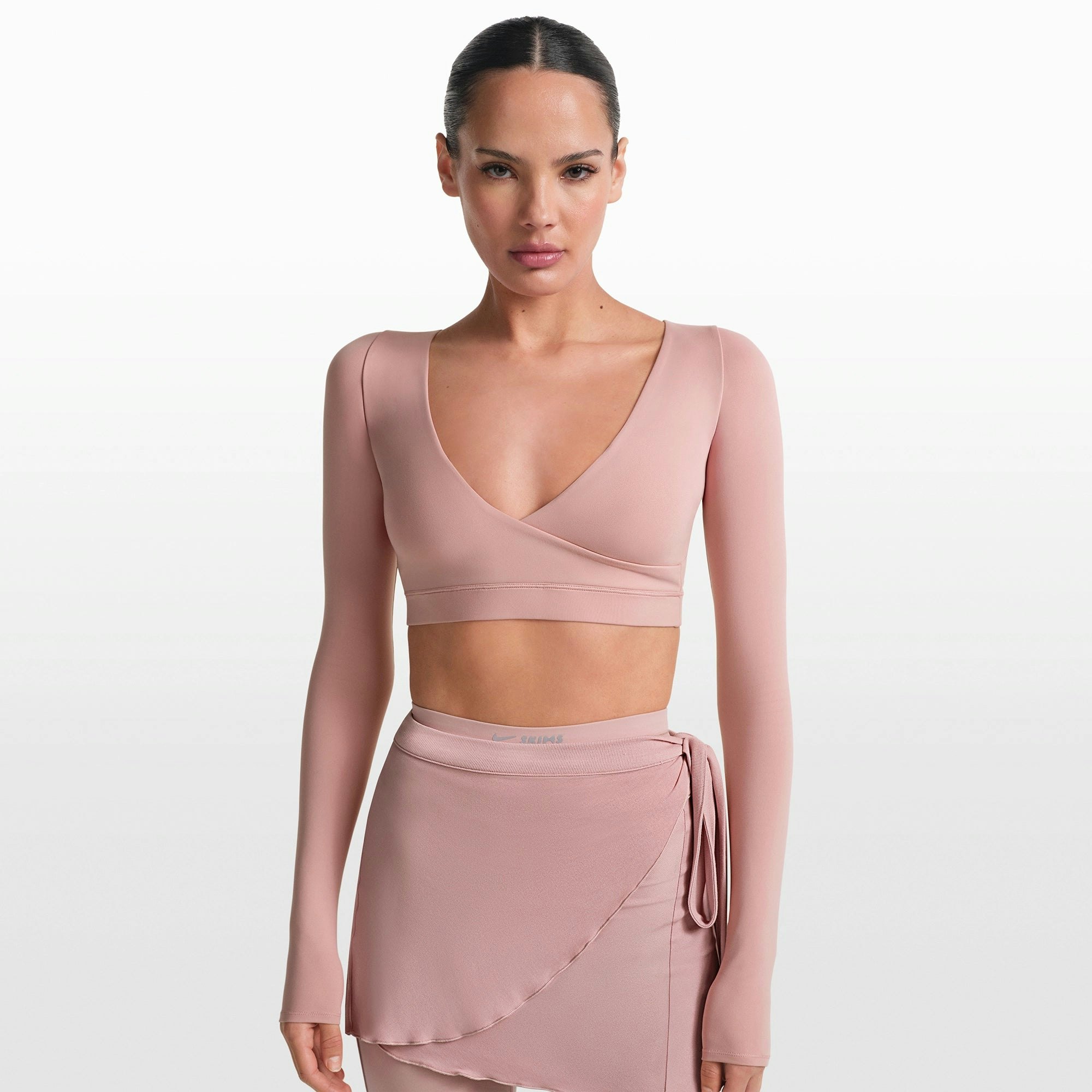 NikeSKIMS MATTE WRAP LONG SLEEVE CROPPED TOP | HIMALAYAN ON A MODEL FRONT VIEW @ | FOCUS: 0.0, 1.0, 0.9