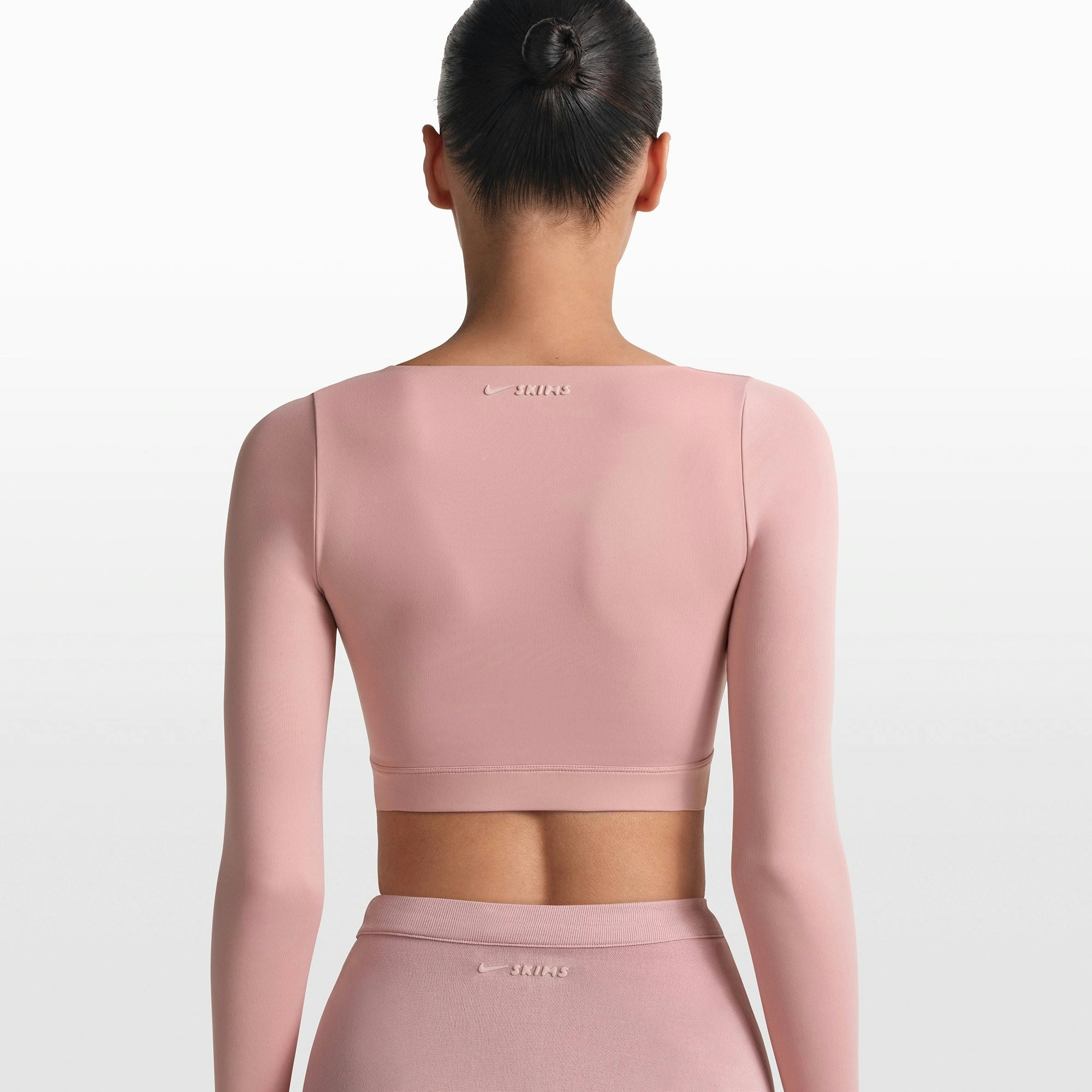 NikeSKIMS MATTE WRAP LONG SLEEVE CROPPED TOP | HIMALAYAN ON A MODEL FRONT VIEW @ | FOCUS: 0.0, 1.0, 0.9
