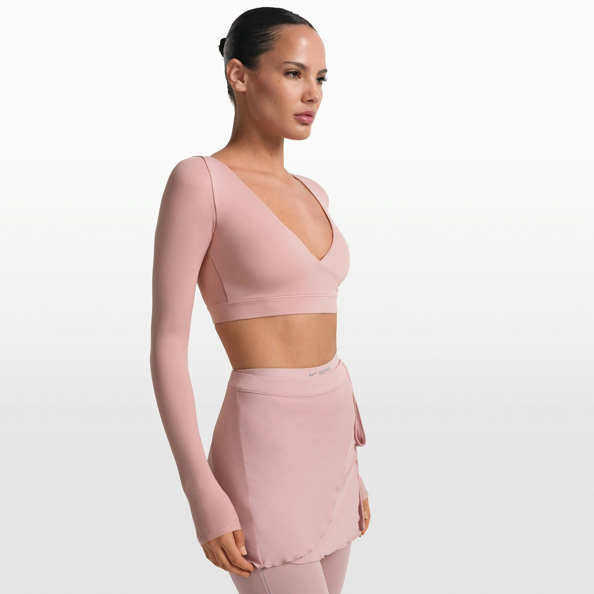 NikeSKIMS MATTE WRAP LONG SLEEVE CROPPED TOP | HIMALAYAN ON A MODEL FRONT VIEW @ | FOCUS: 0.0, 1.0, 0.9