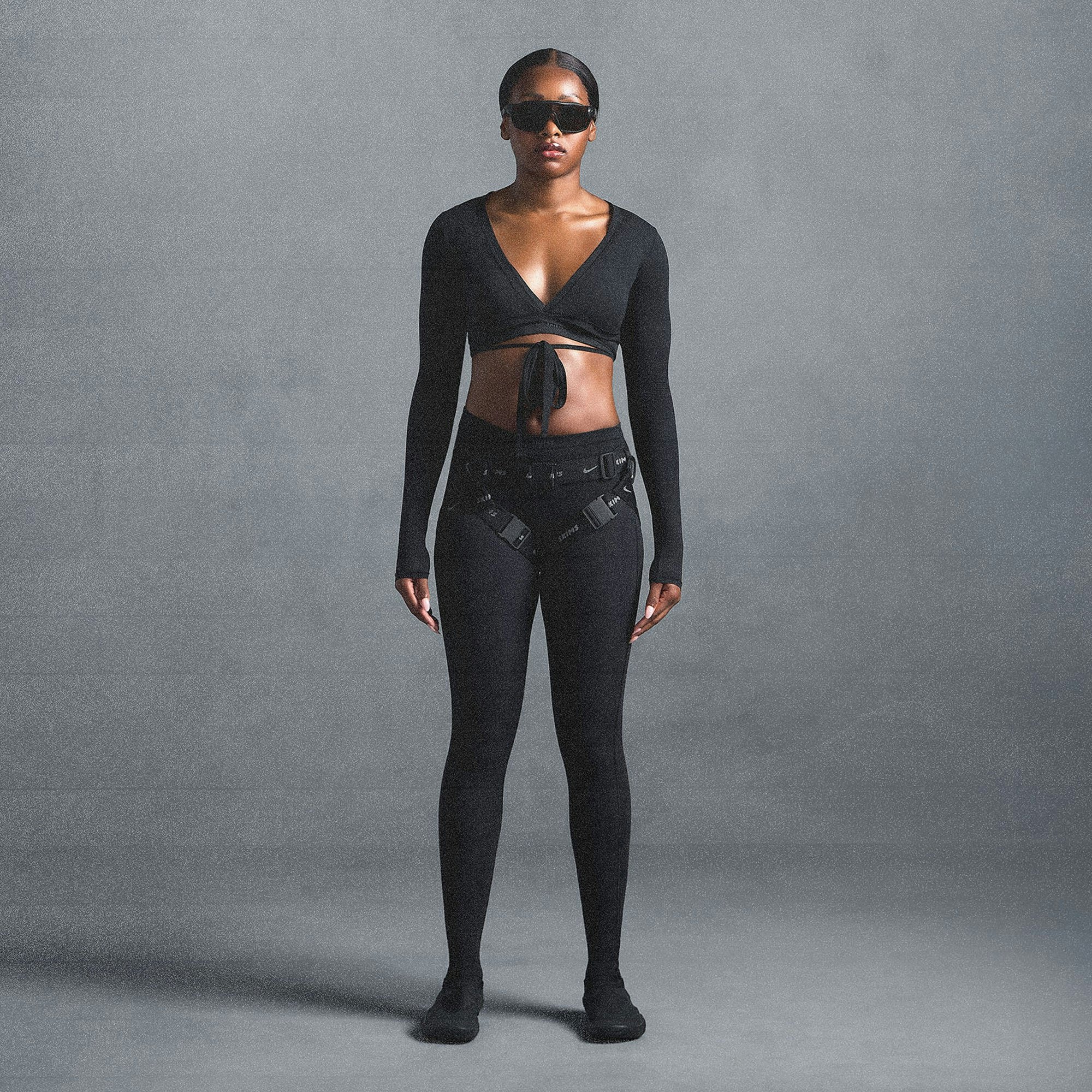 NikeSKIMS WEIGHTLESS LAYERS WRAP TOP | OBSIDIAN ON A MODEL SIDE VIEW @ | FOCUS: 0.0, 1.0, 0.9