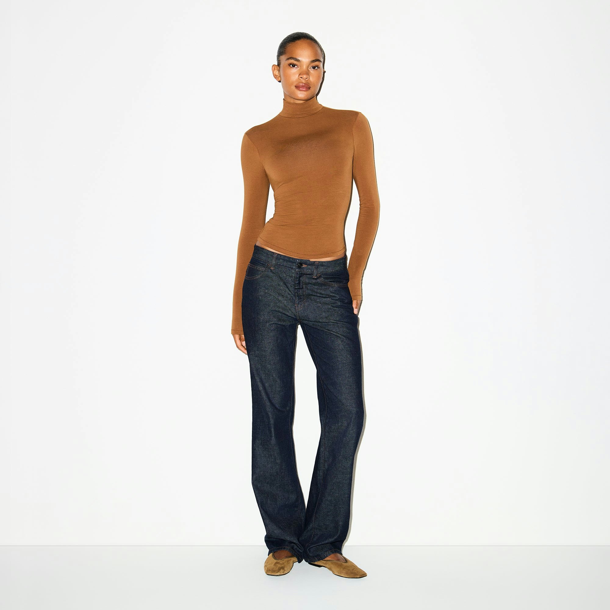 COTTON JERSEY TURTLENECK | CHAI ON A MODEL FRONT VIEW @ | FOCUS: 0.0, 1.0, 0.9