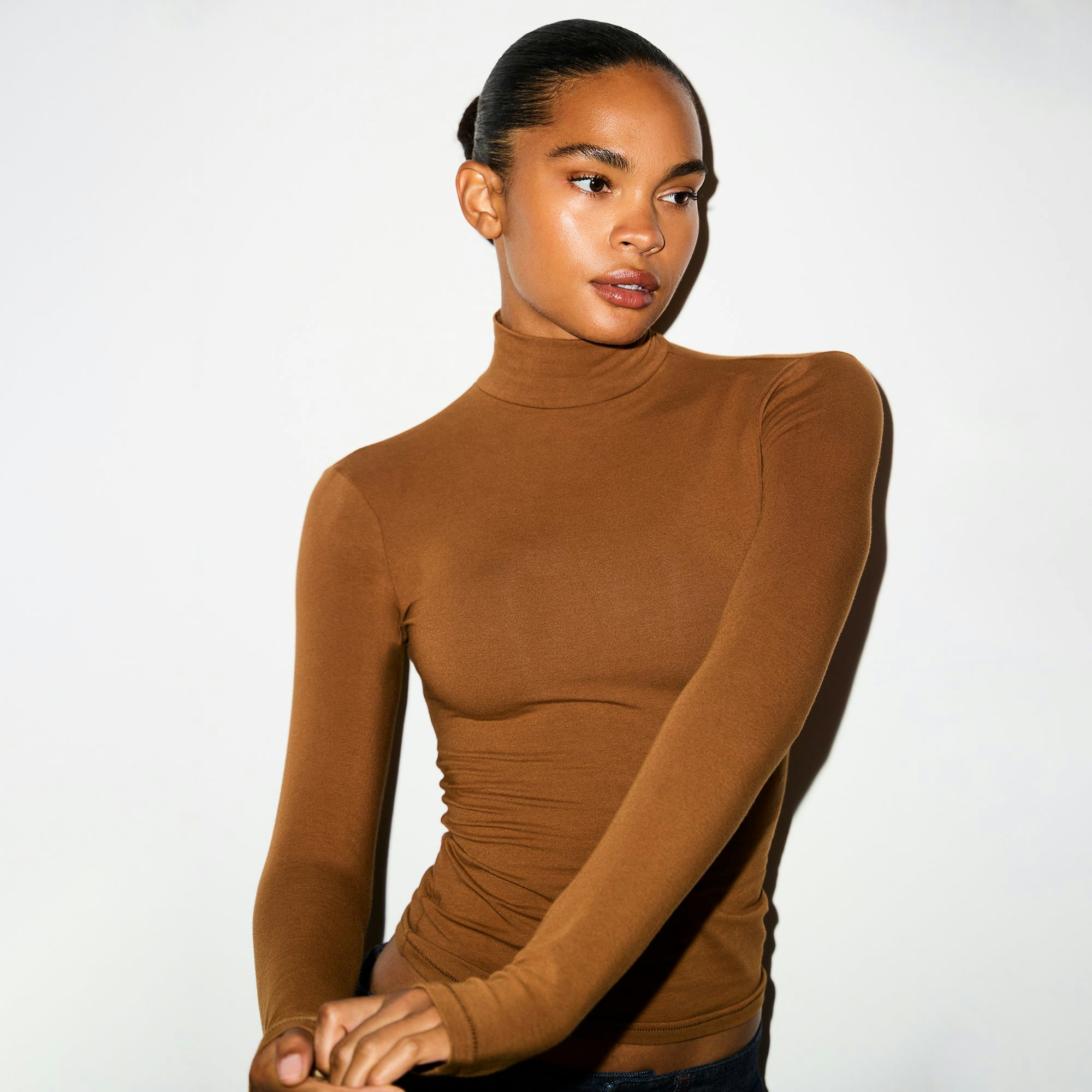 COTTON JERSEY TURTLENECK | CHAI ON A MODEL FRONT VIEW @ | FOCUS: 0.0, 1.0, 0.9