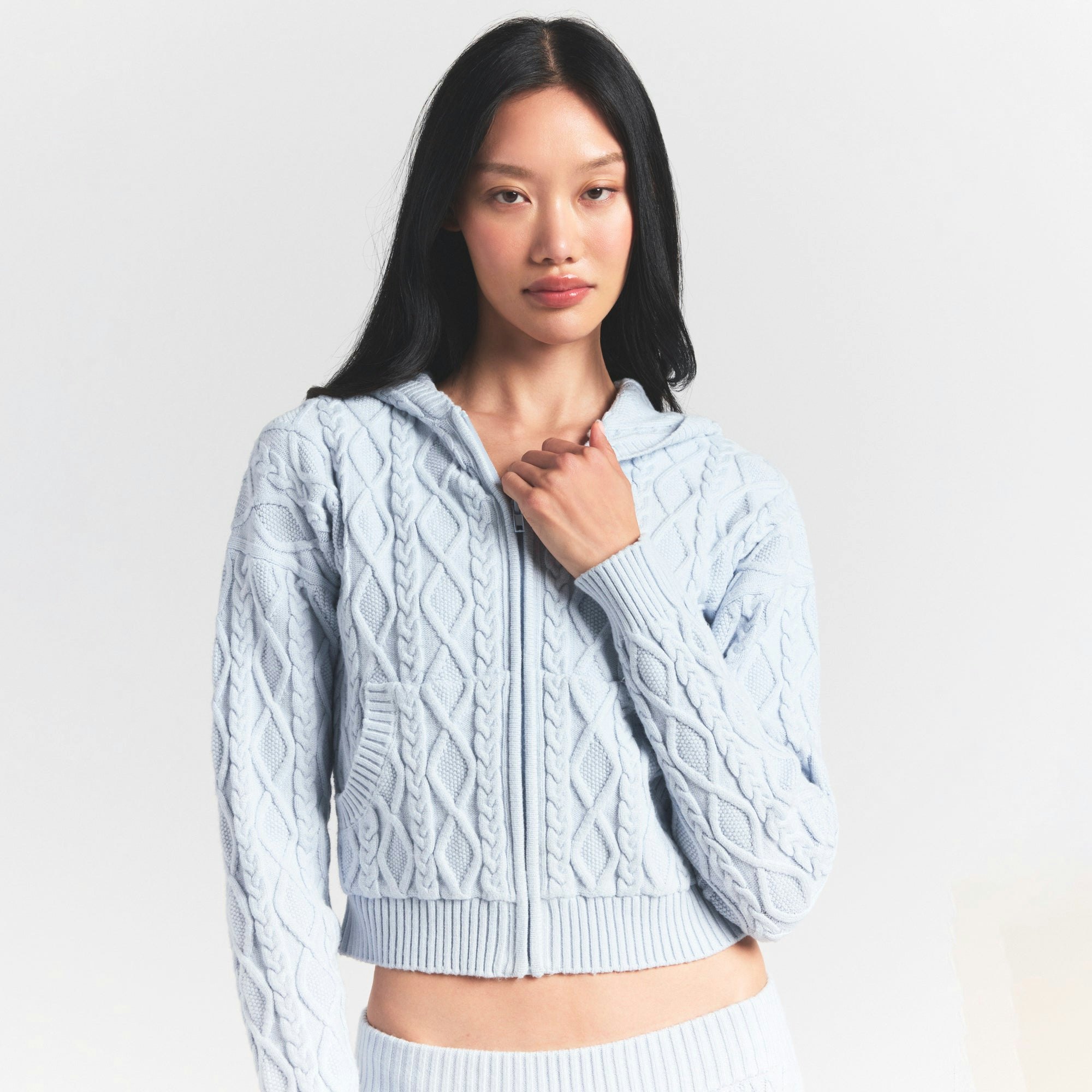 SWEATER KNITS CABLE SHRUNKEN ZIP UP HOODIE | ZEN BLUE ON A MODEL SIDE VIEW @ | FOCUS: 0.0, 1.0, 0.9