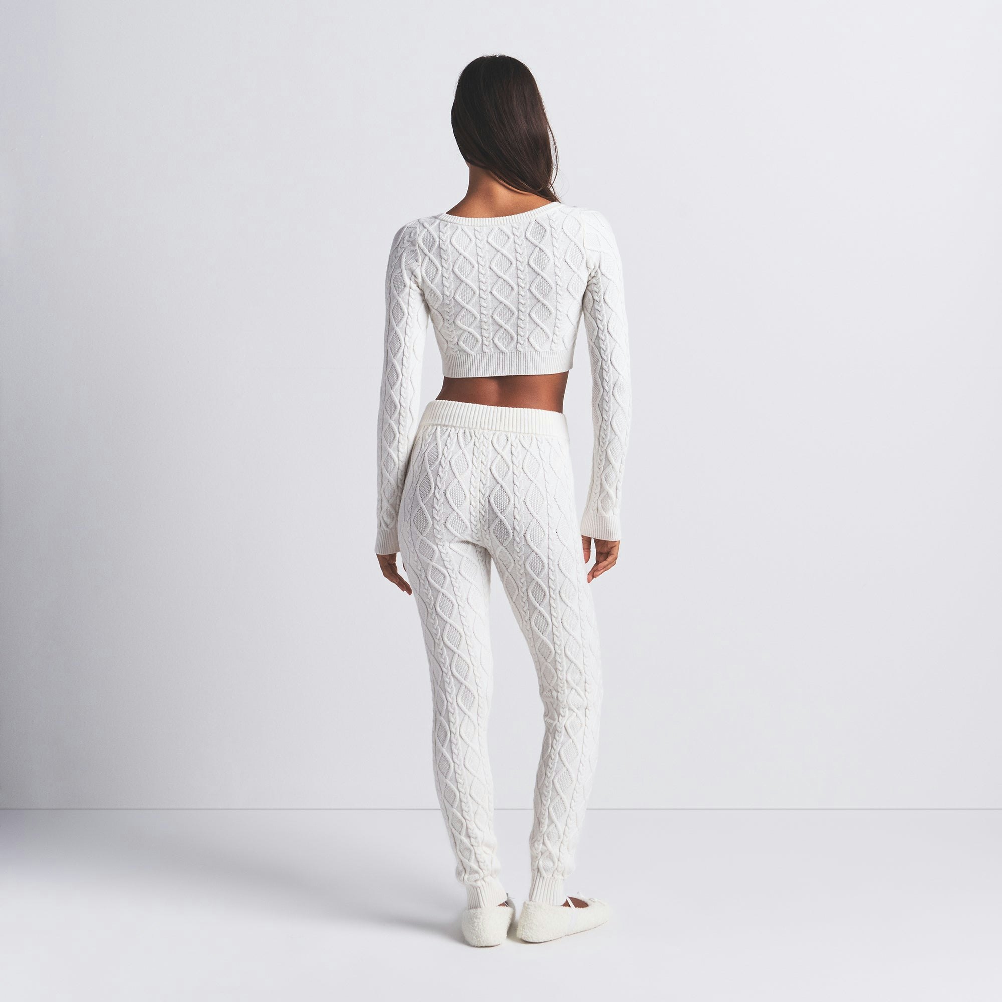 SWEATER KNIT CROPPED CARDIGAN | IVORY ON A MODEL BACK VIEW @ | FOCUS: 0.0, 1.0, 0.9