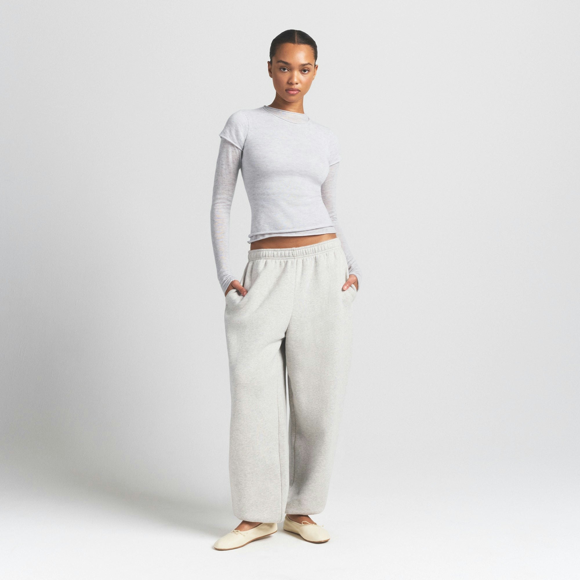 FEATHERWEIGHT CASHMERE LONG SLEEVE TOP | LIGHT HEATHER GREY ON A MODEL FRONT VIEW @ | FOCUS: 0.9, 0.1, 0.7