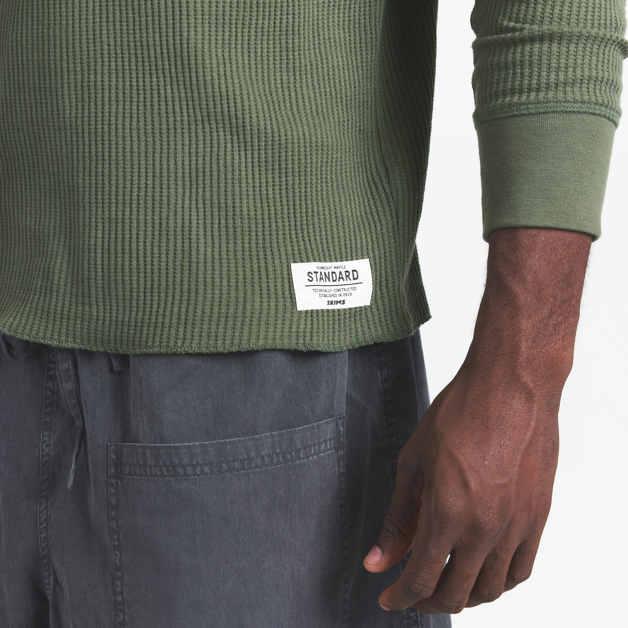 WAFFLE MENS LONG SLEEVE TOP | MILITARY GREEN ON A MODEL SIDE VIEW @ | FOCUS: 0.0, 1.0, 0.9