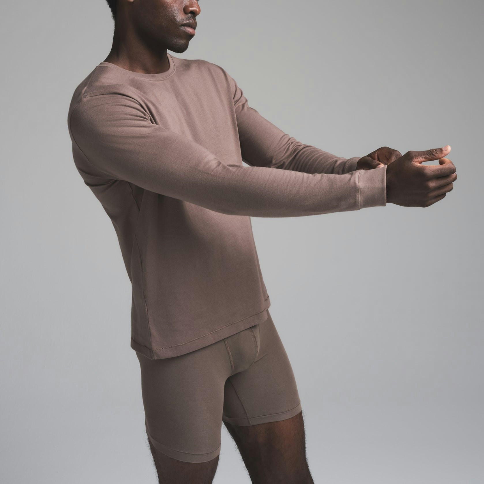 SKIMS COTTON MENS CLASSIC LONG SLEEVE T-SHIRT | AMETHYST ON A MODEL SIDE VIEW