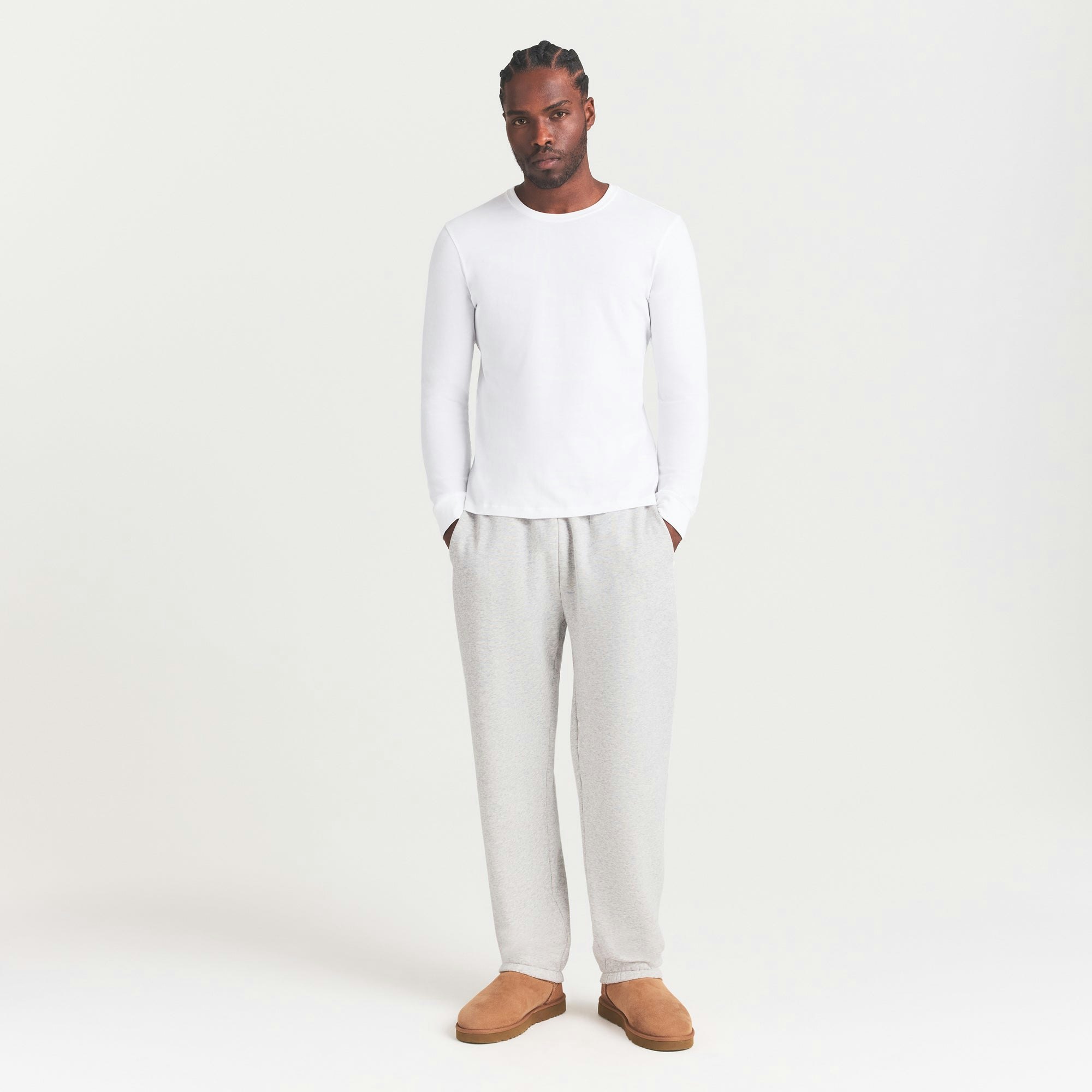 SKIMS COTTON MENS CLASSIC LONG SLEEVE T-SHIRT | CHALK ON A MODEL SIDE VIEW | FOCUS: 0.0, 1.0, 0.9