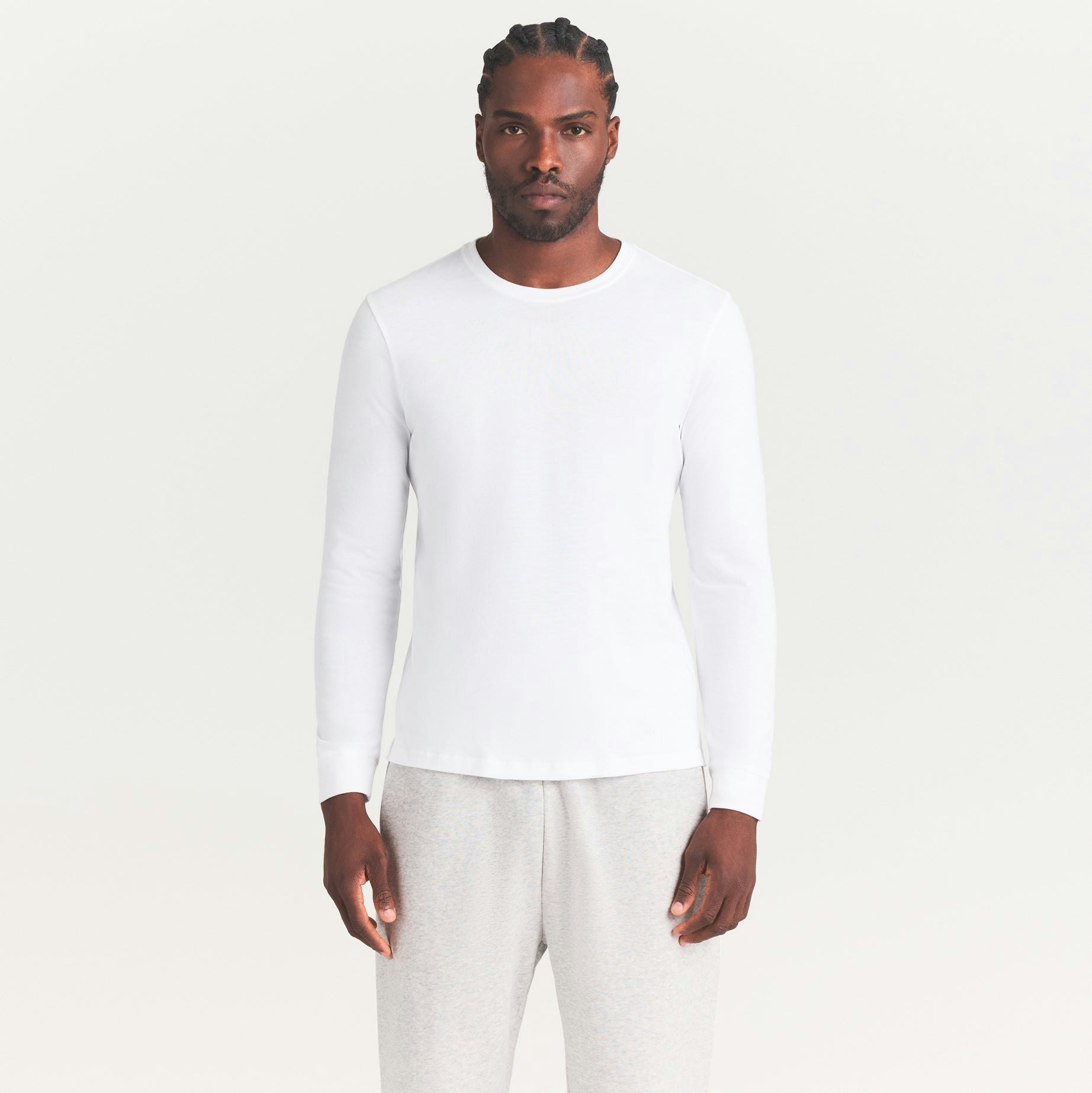 SKIMS COTTON MENS CLASSIC LONG SLEEVE T-SHIRT | CHALK ON A MODEL SIDE VIEW | FOCUS: 0.0, 1.0, 0.9