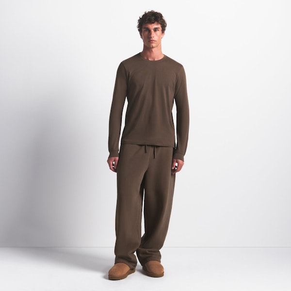 SKIMS COTTON MENS CLASSIC LONG SLEEVE T-SHIRT | DRIFTWOOD ON A MODEL FRONT VIEW @ | FOCUS: 0.0, 1.0, 0.9