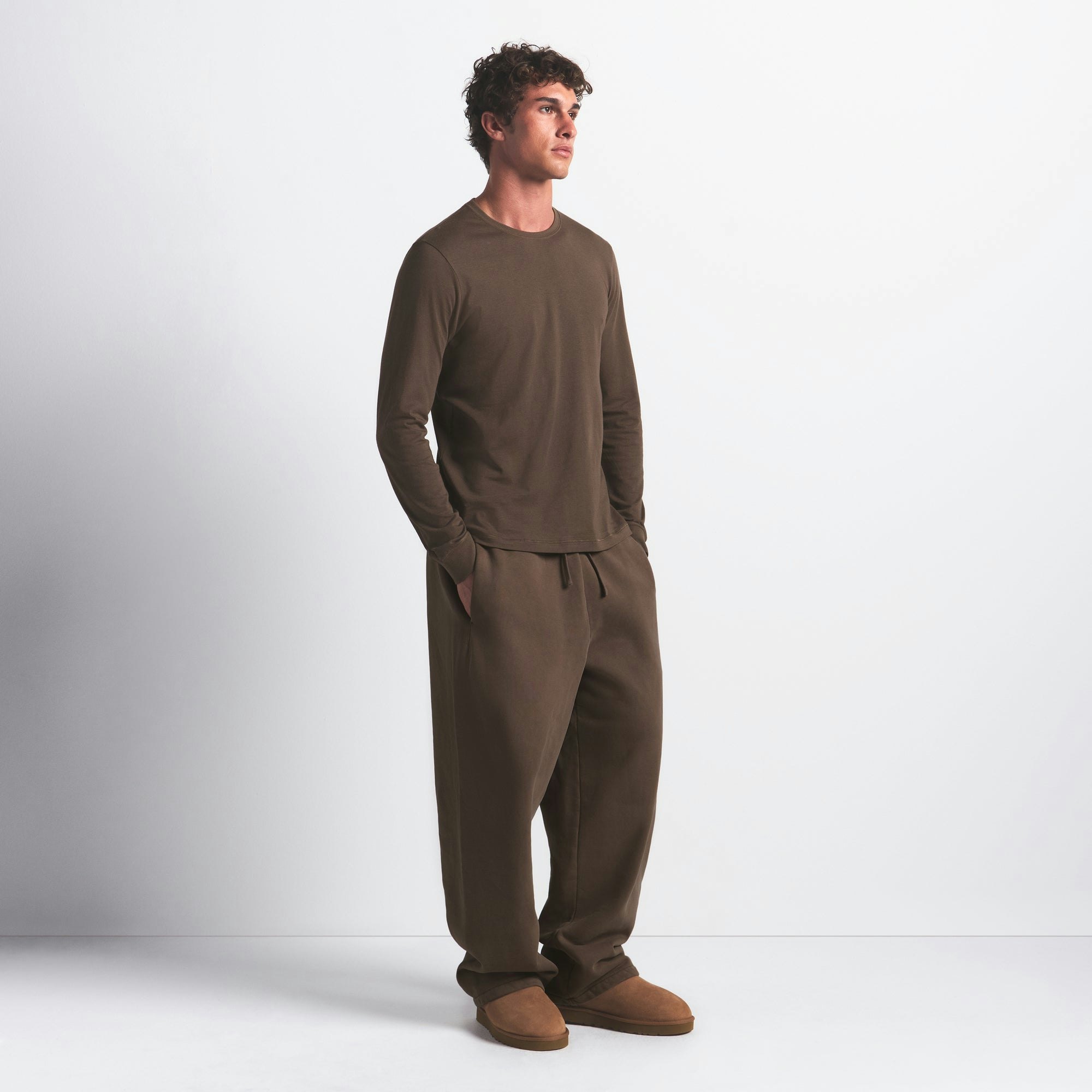 SKIMS COTTON MENS CLASSIC LONG SLEEVE T-SHIRT | DRIFTWOOD ON A MODEL FRONT VIEW @ | FOCUS: 0.0, 1.0, 0.9