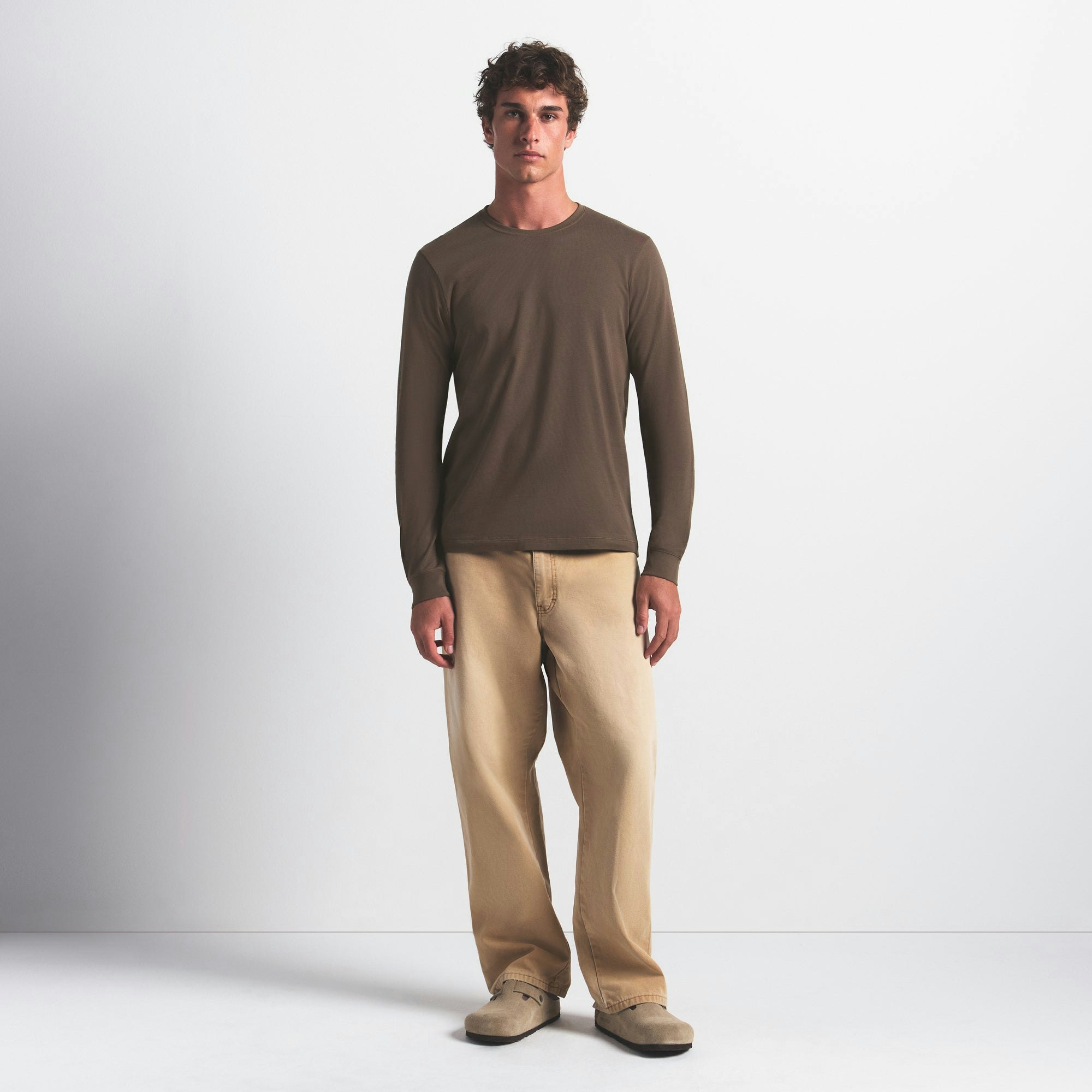 SKIMS COTTON MENS CLASSIC LONG SLEEVE T-SHIRT | DRIFTWOOD ON A MODEL FRONT VIEW @ | FOCUS: 0.0, 1.0, 0.9