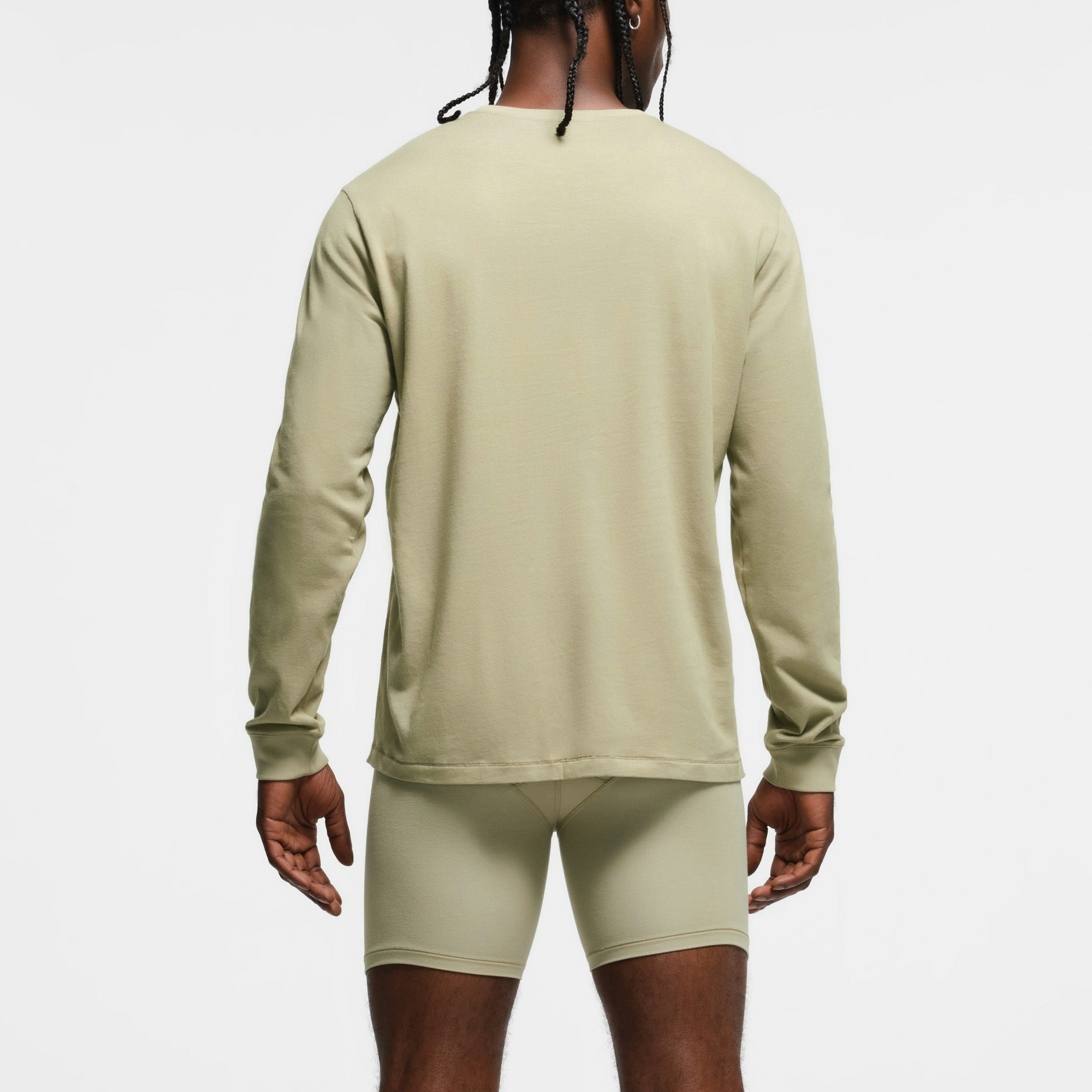 SKIMS COTTON MENS CLASSIC LONG SLEEVE T-SHIRT | PHOENIX ON A MODEL BACK VIEW