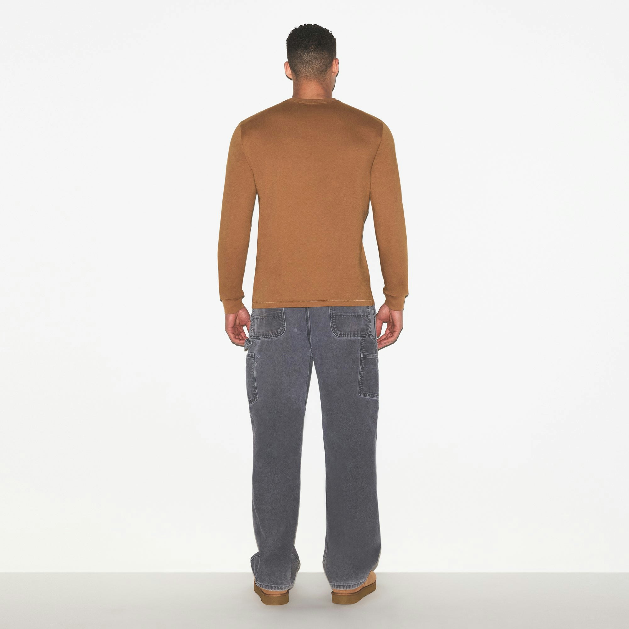 SKIMS COTTON MENS CLASSIC LONG SLEEVE T-SHIRT | RUSSET ON A MODEL FRONT VIEW @ | FOCUS: 0.0, 1.0, 0.9
