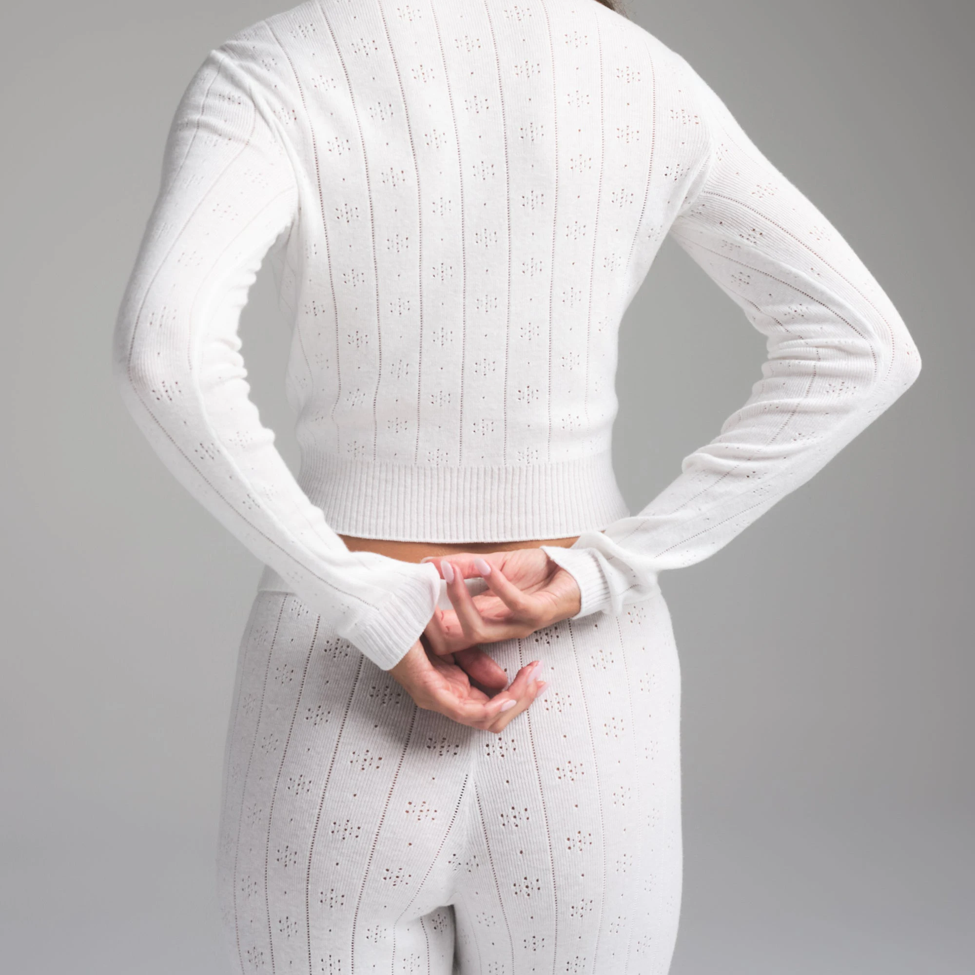 SWEATER POINTELLE LONG SLEEVE TOP | MARBLE ON A MODEL SIDE VIEW