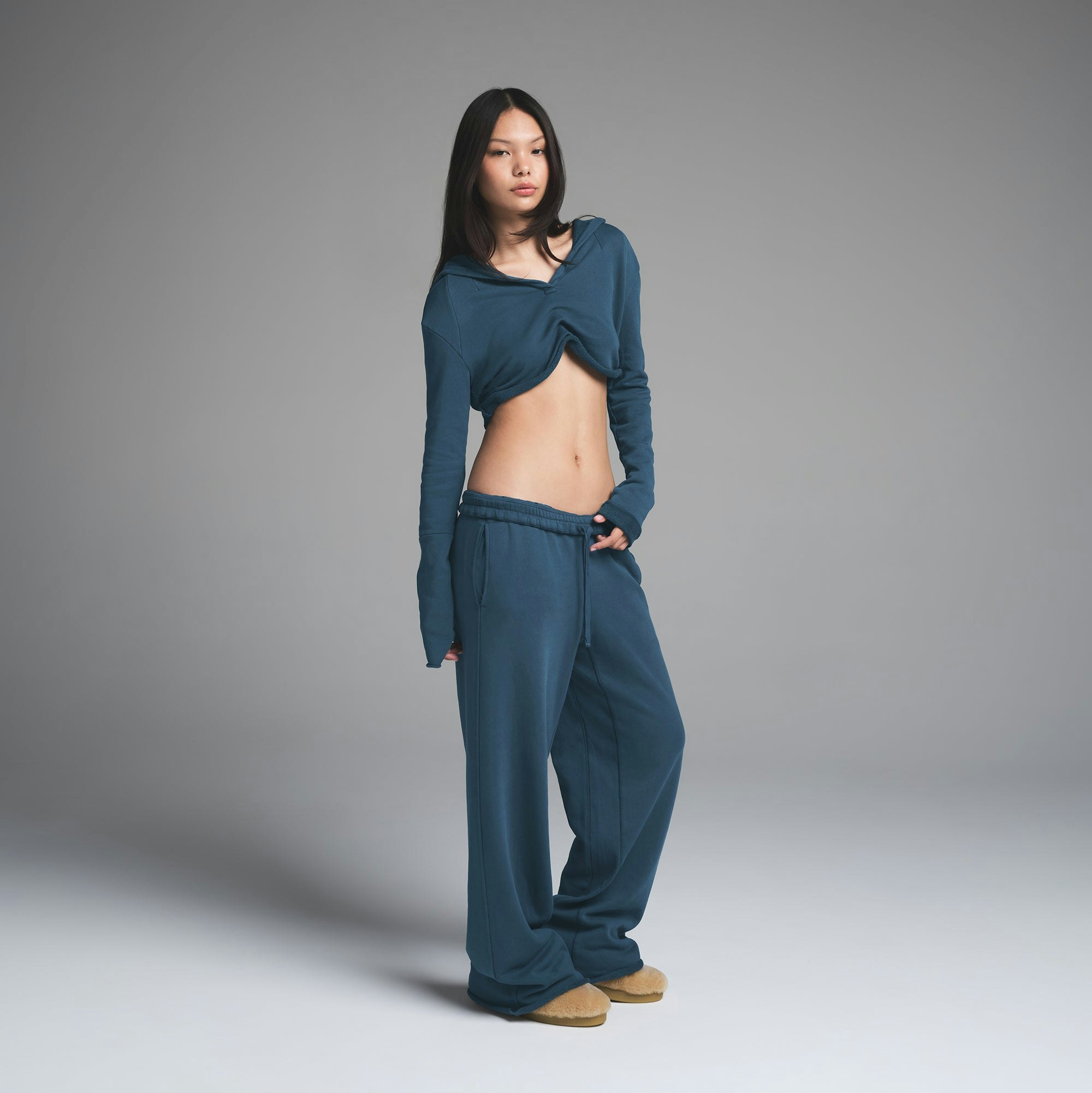 FRENCH TERRY SHOULDER PAD CROPPED HOODIE | INDIGO ON A MODEL FRONT VIEW | FOCUS: 0.0, 1.0, 0.9