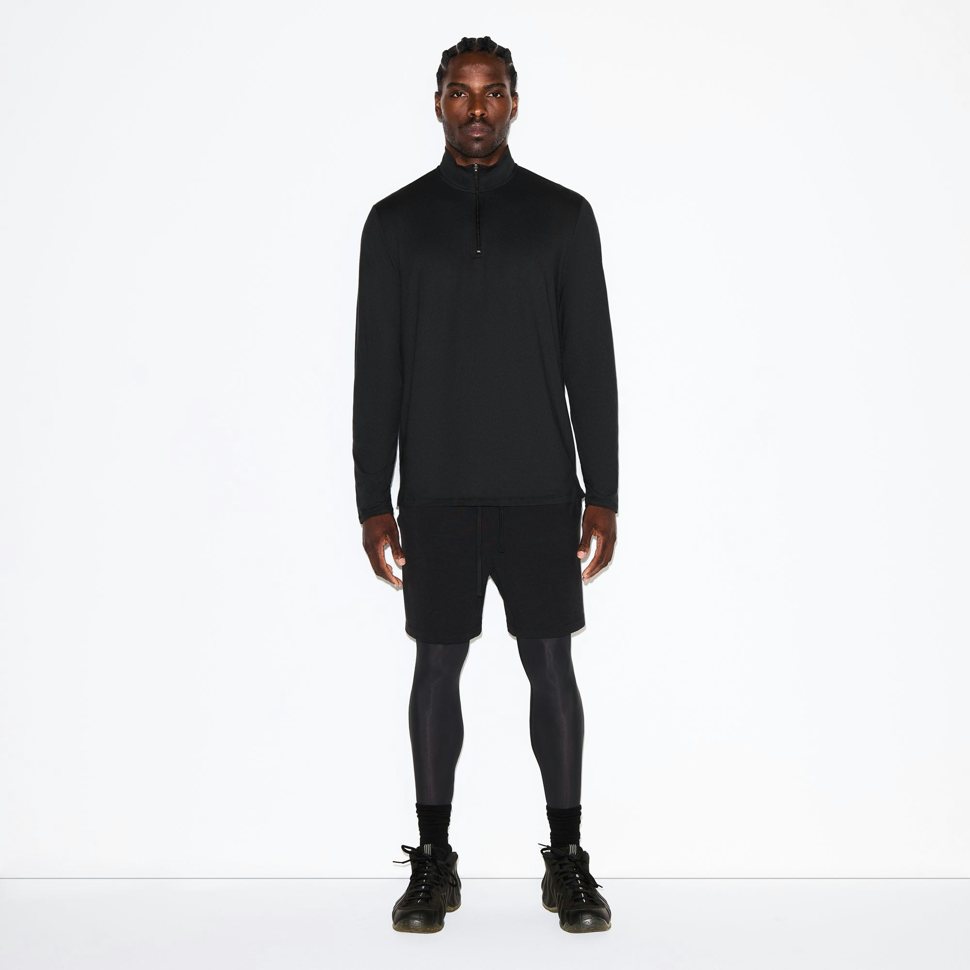 OUTDOOR JERSEY MENS HALF ZIP TOP | ONYX ON A MODEL FRONT VIEW @ | FOCUS: 0.0, 1.0, 0.9