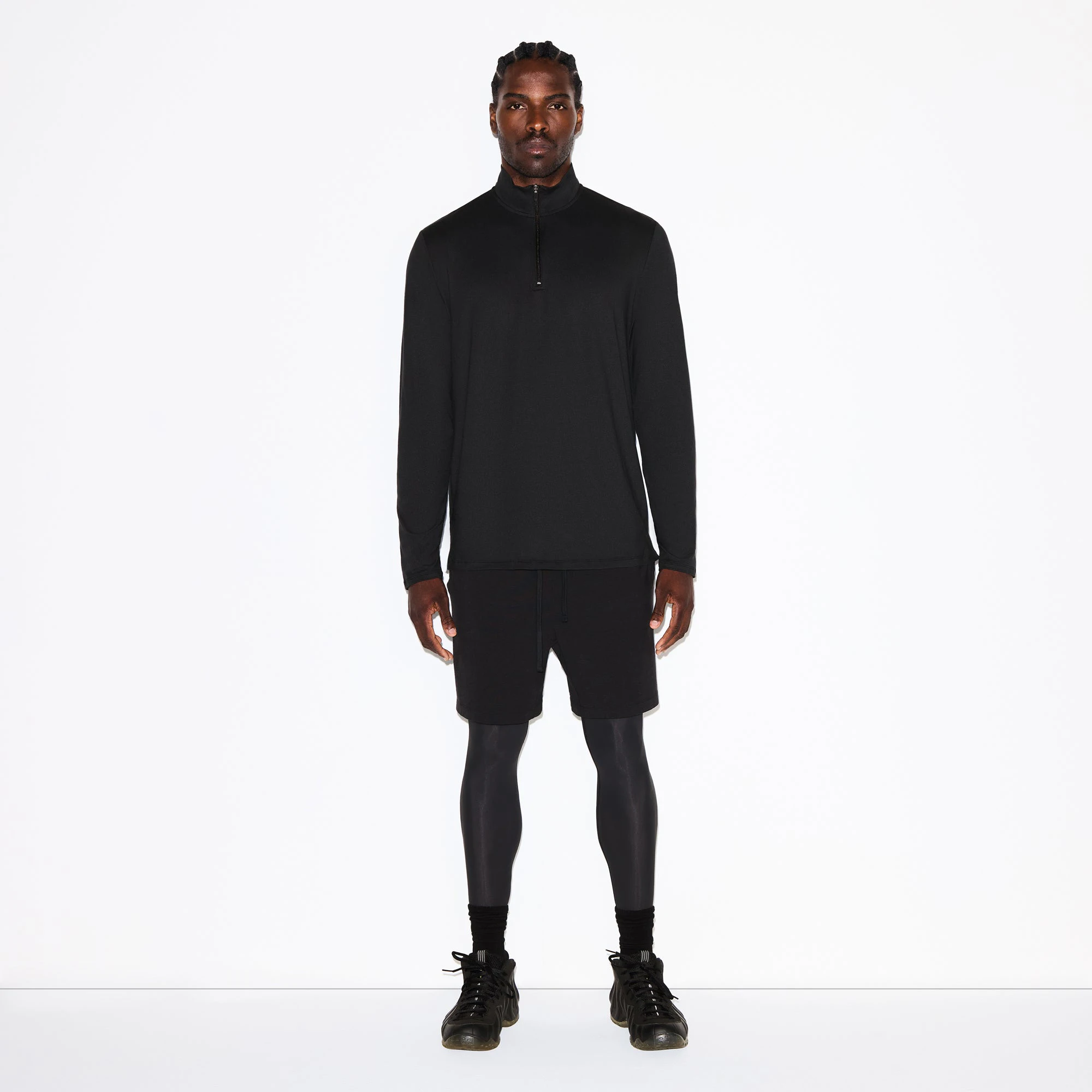 OUTDOOR JERSEY MENS HALF ZIP TOP | ONYX ON A MODEL FRONT VIEW @ | FOCUS: 0.0, 1.0, 0.9