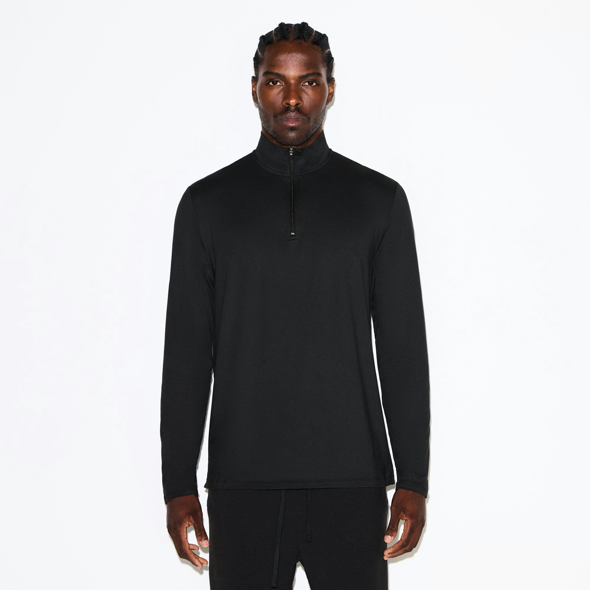OUTDOOR JERSEY MENS HALF ZIP TOP | ONYX ON A MODEL SIDE VIEW @ | FOCUS: 0.0, 1.0, 0.9