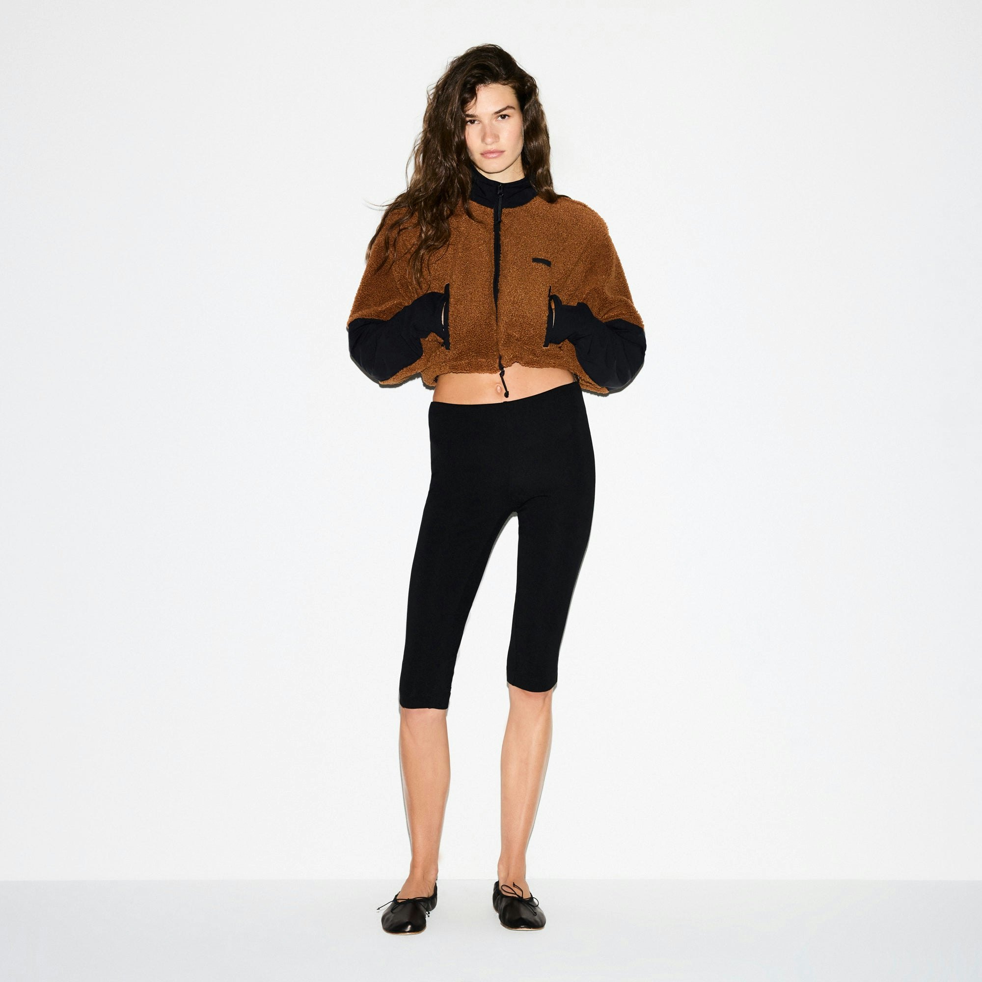 TEDDY FUNNEL NECK CROPPED JACKET | CHAI ON A MODEL SIDE VIEW @ | FOCUS: 0.0, 1.0, 0.9