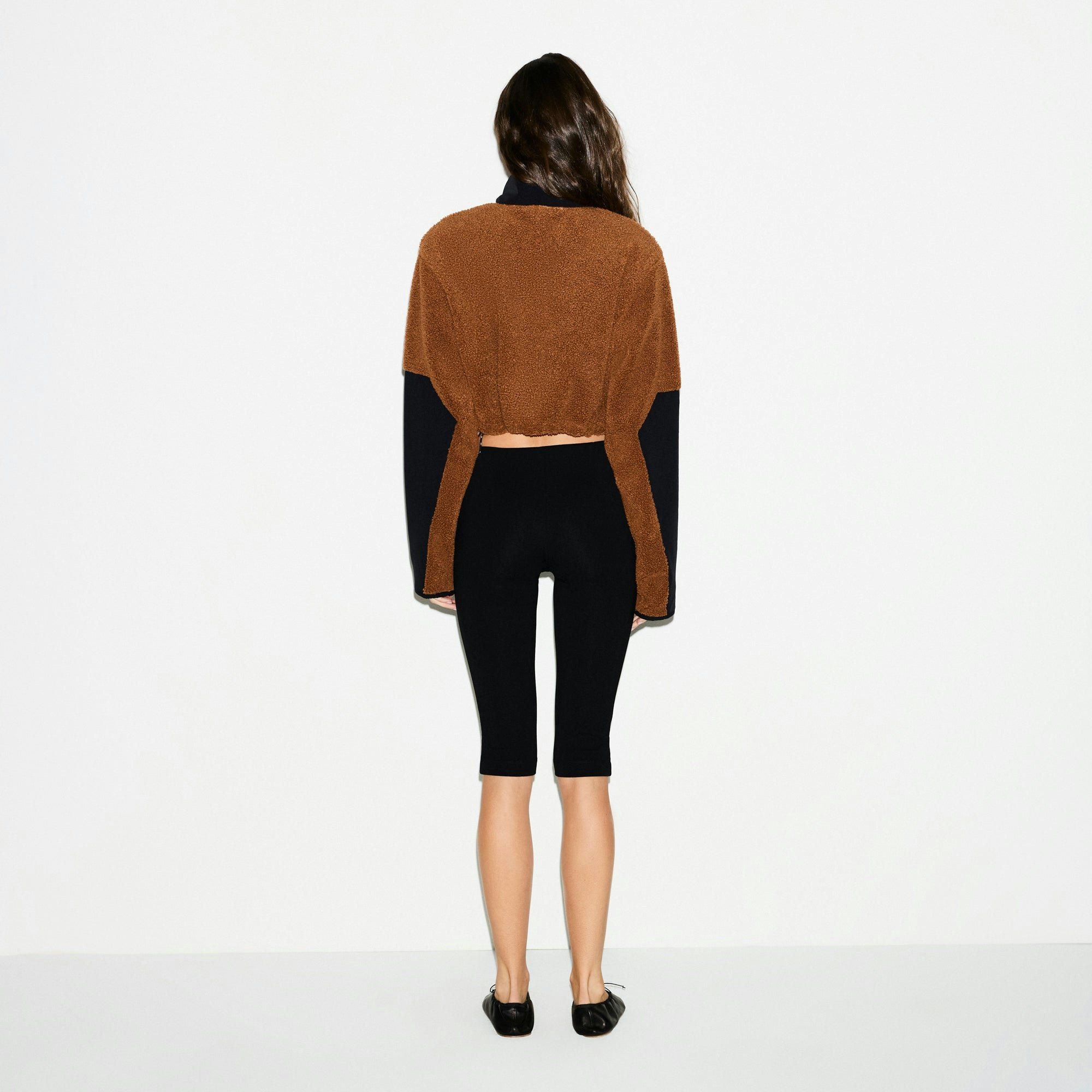 TEDDY FUNNEL NECK CROPPED JACKET | CHAI ON A MODEL SIDE VIEW @ | FOCUS: 0.0, 1.0, 0.9