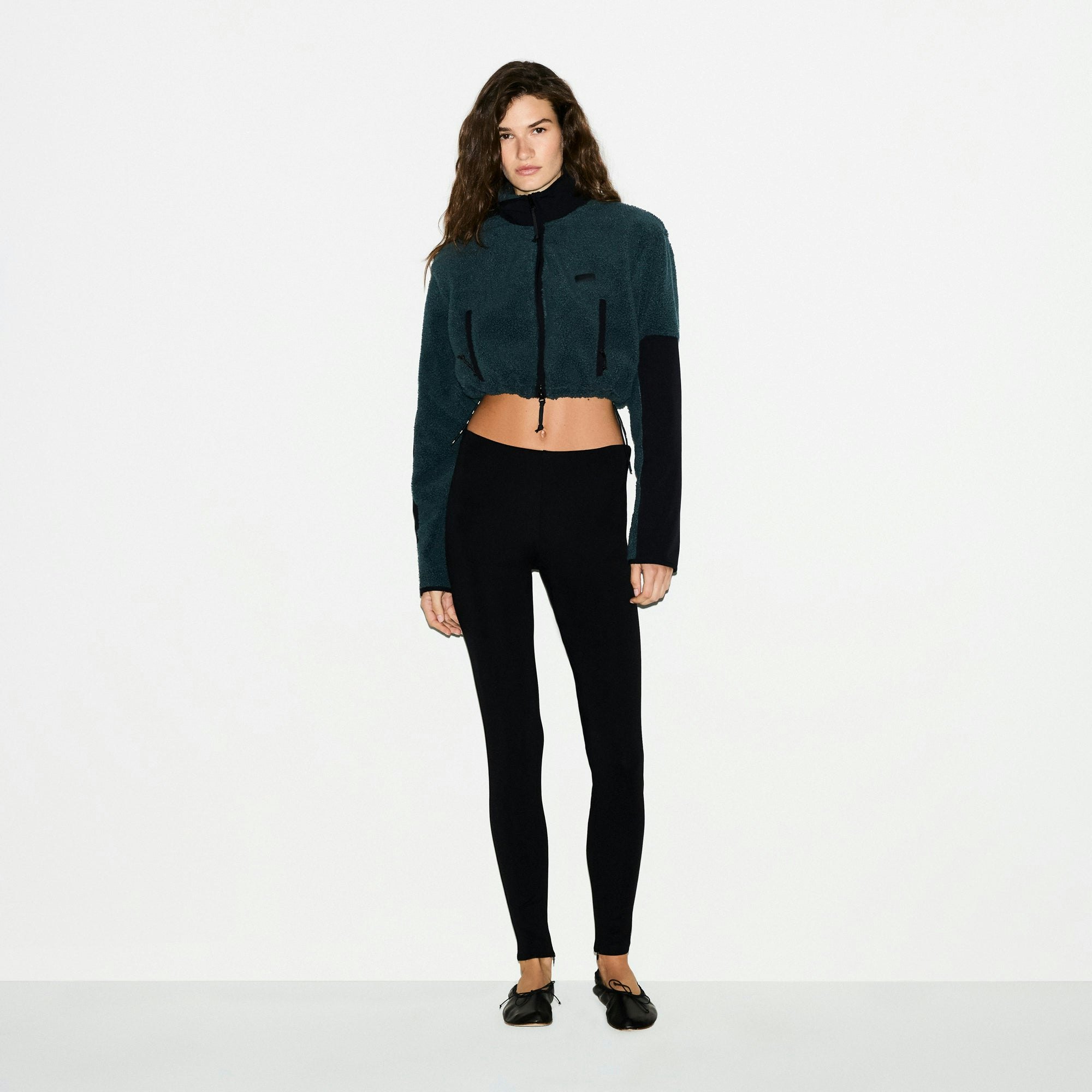 TEDDY FUNNEL NECK CROPPED JACKET | DARK TEAL ON A MODEL FRONT VIEW @ | FOCUS: 0.0, 1.0, 0.9