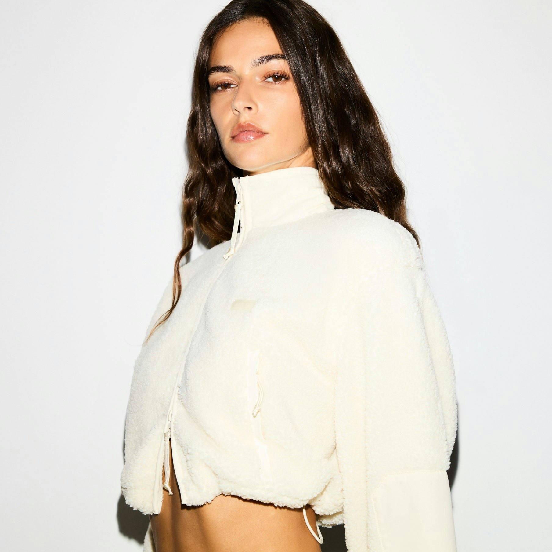 TEDDY FUNNEL NECK CROPPED JACKET | ECRU ON A MODEL SIDE VIEW @ | FOCUS: 0.0, 1.0, 0.9