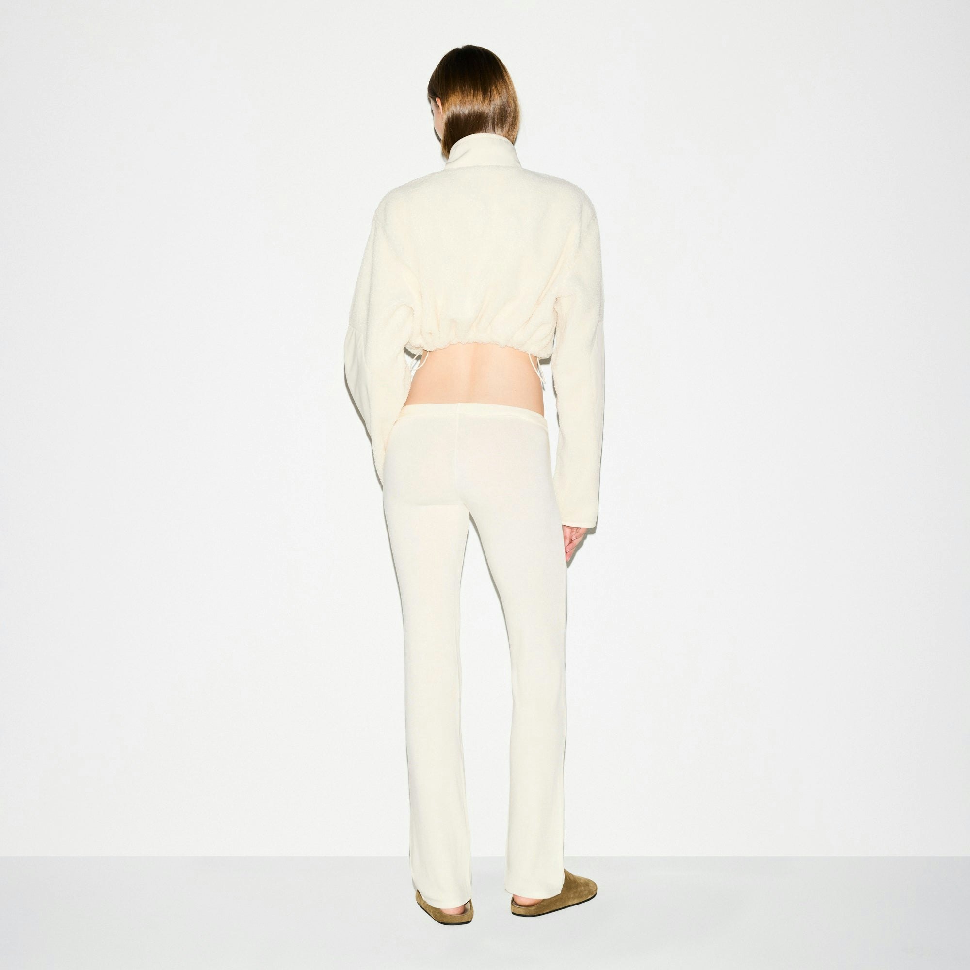 TEDDY FUNNEL NECK CROPPED JACKET | ECRU ON A MODEL SIDE VIEW @ | FOCUS: 0.0, 1.0, 0.9