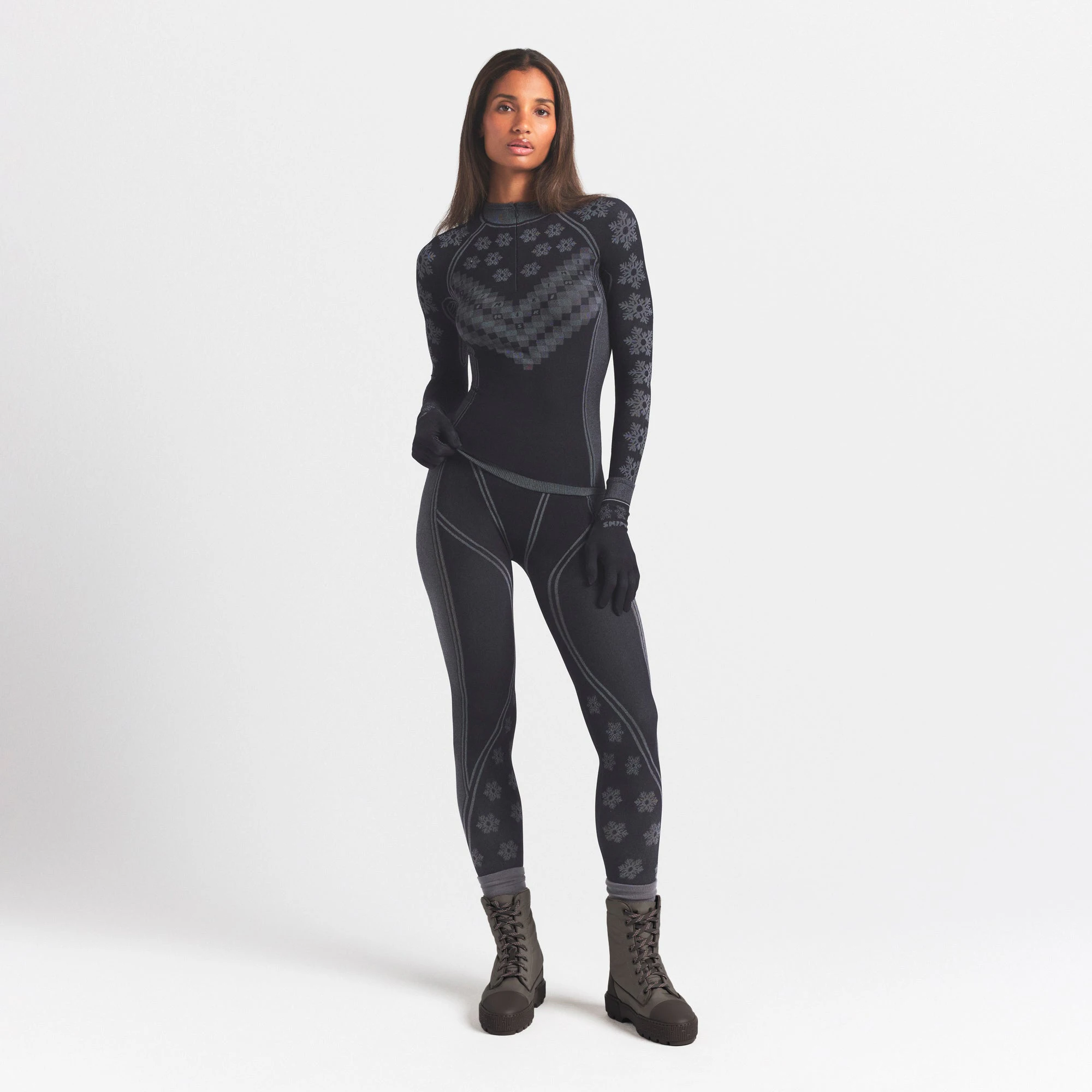 SKIMS FIRST LAYERS HALF ZIP LONG SLEEVE | OBSIDIAN WINTER FAIR ISLE ON A MODEL FRONT VIEW @ | FOCUS: 0.0, 1.0, 0.9