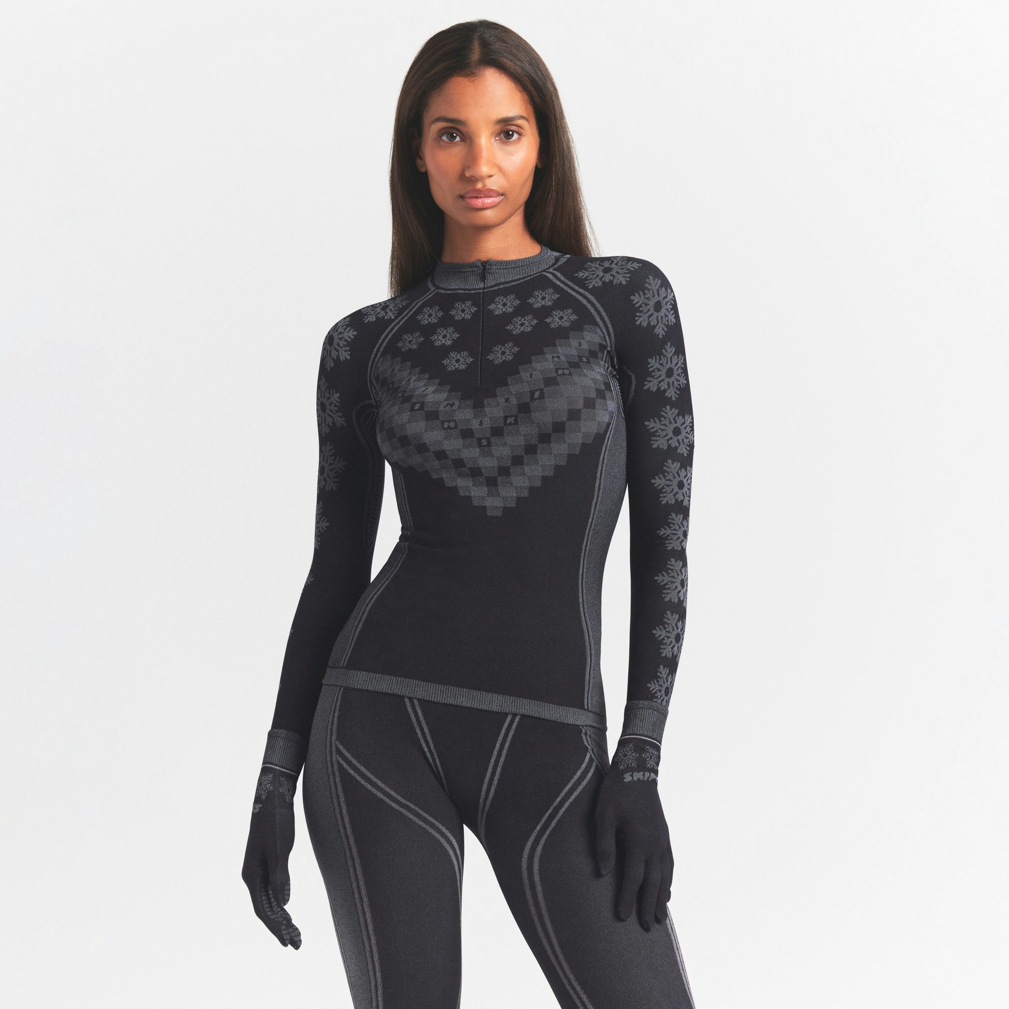 SKIMS FIRST LAYERS HALF ZIP LONG SLEEVE | OBSIDIAN WINTER FAIR ISLE ON A MODEL SIDE VIEW @ | FOCUS: 0.0, 1.0, 0.9