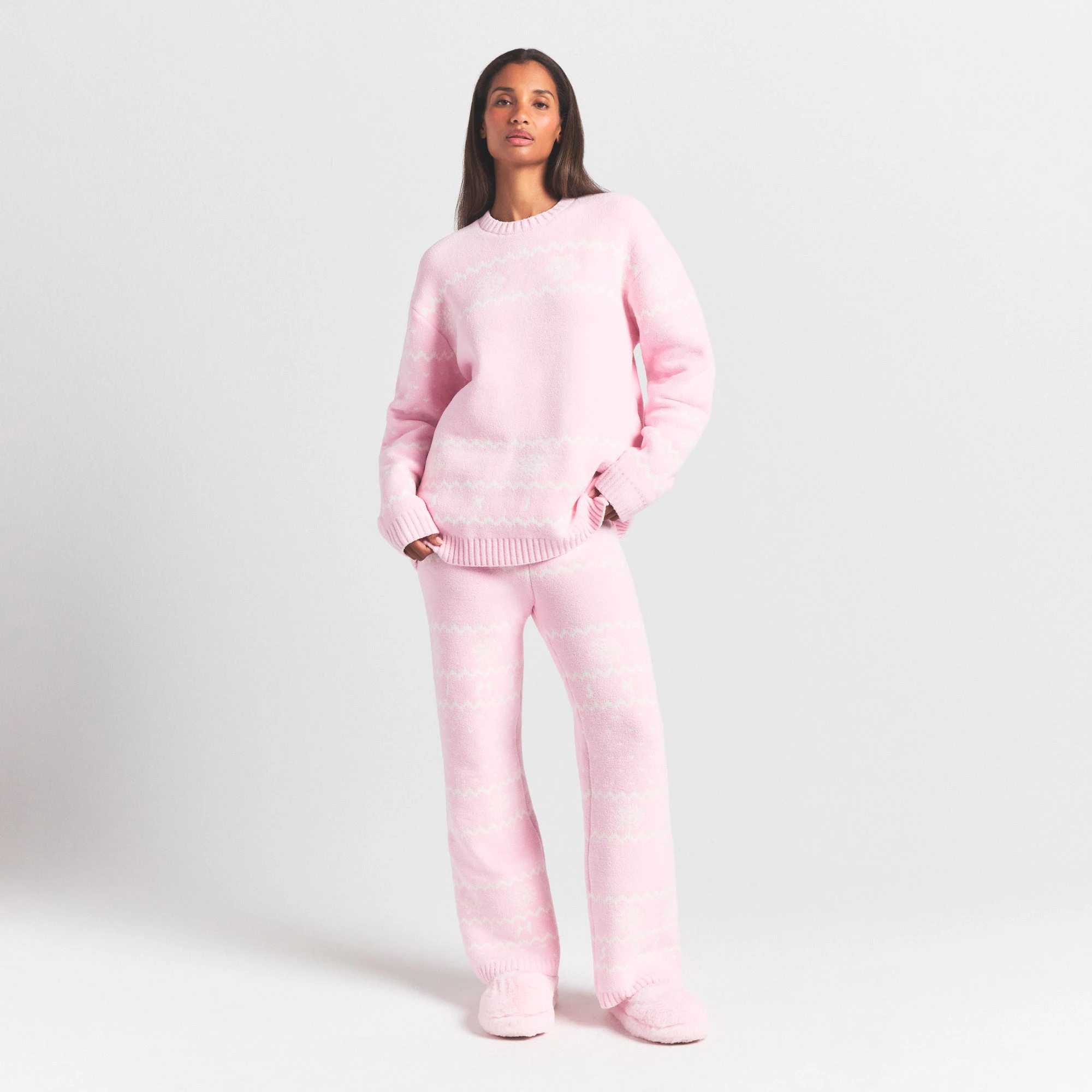 COZY LIGHT CREWNECK PULLOVER | BABY PINK HEART FAIR ISLE ON A MODEL FRONT VIEW @ | FOCUS: 0.0, 1.0, 0.9