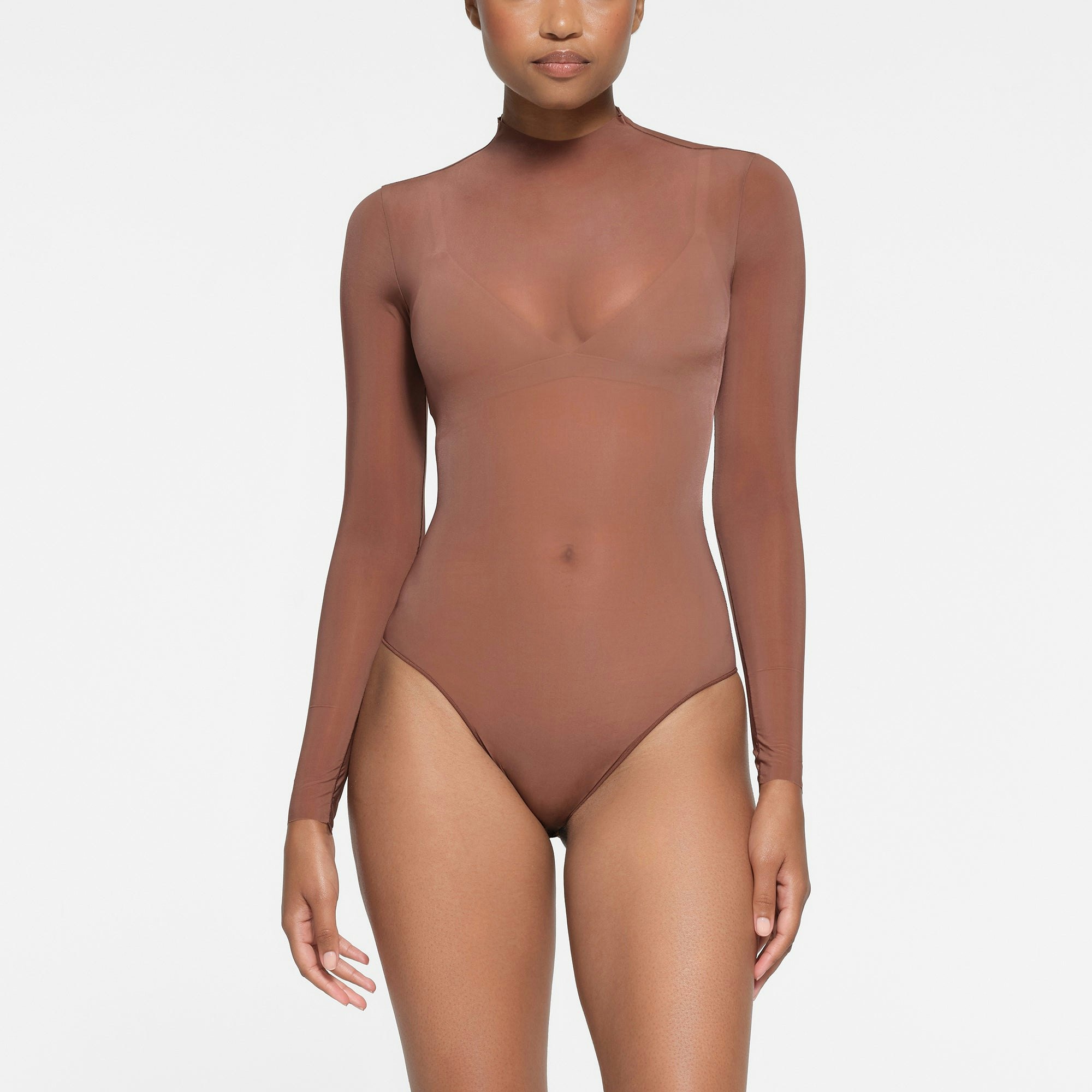 MILKY SHEER MOCK NECK LONG SLEEVE BRIEF BODYSUIT | BRANDY ON A MODEL FRONT VIEW