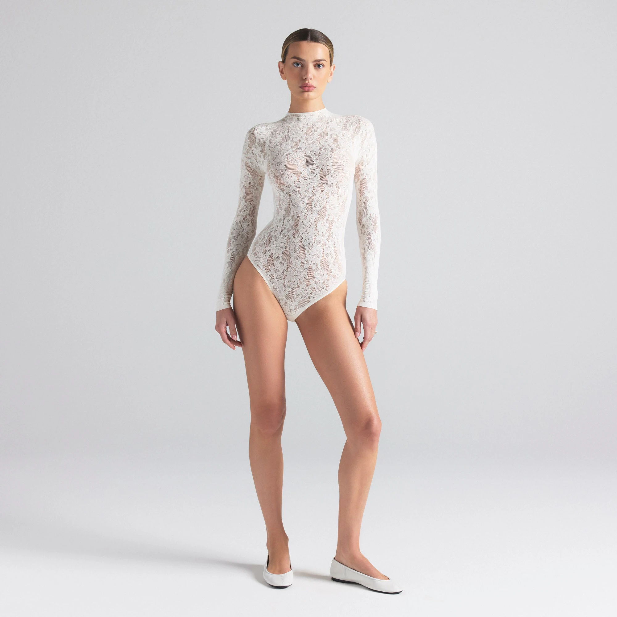 KNIT LACE MOCK NECK BODYSUIT | IVORY ON A MODEL FRONT  ON A MODEL FRONT VIEW | FOCUS: 0.0, 1.0, 0.9