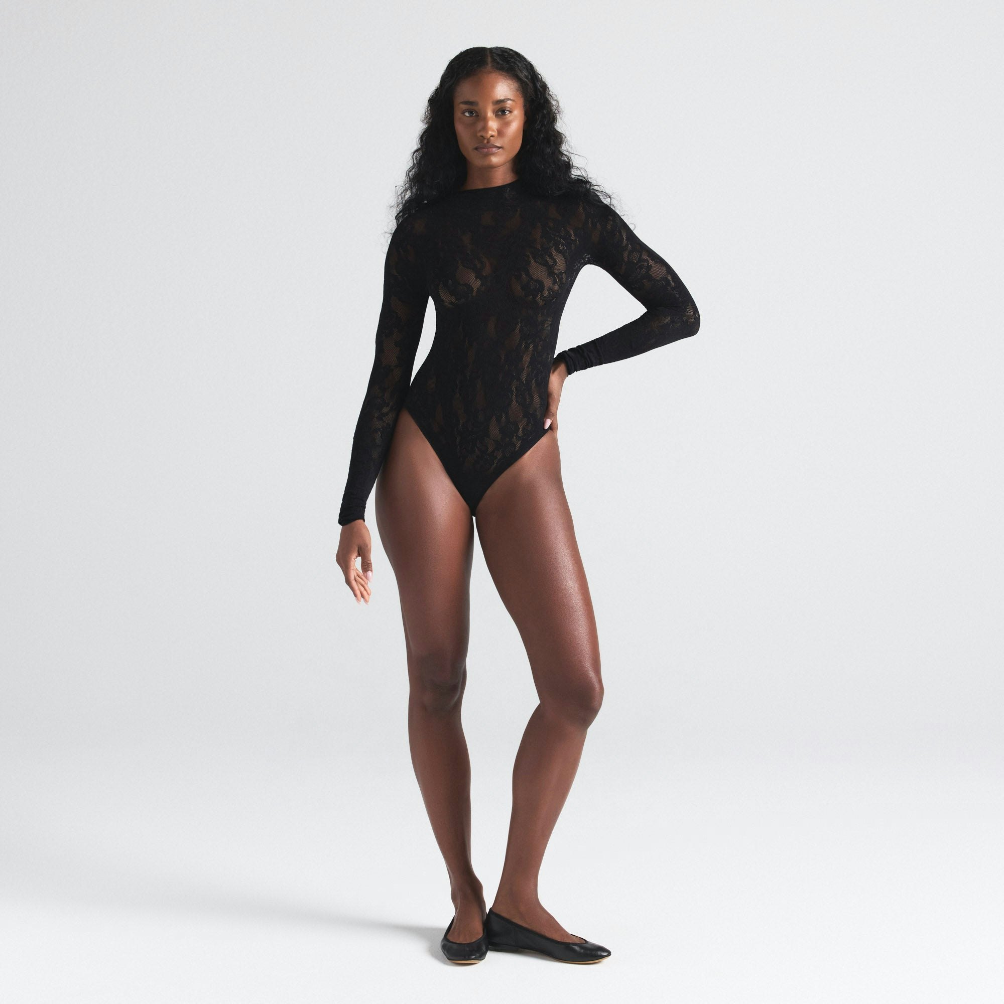 KNIT LACE MOCK NECK BODYSUIT | ONYX ON A MODEL FRONT  ON A MODEL FRONT VIEW | FOCUS: 0.0, 1.0, 0.9