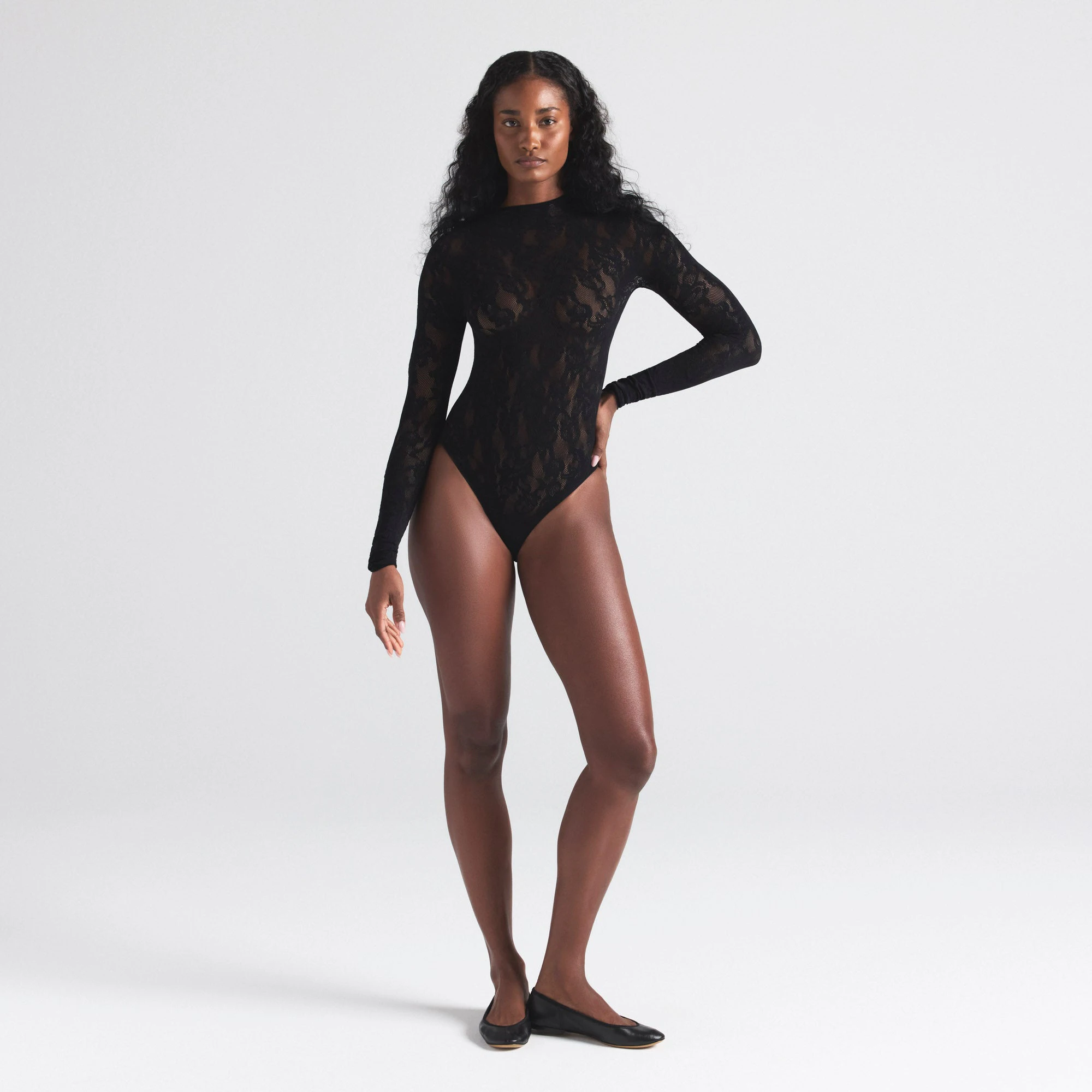 KNIT LACE MOCK NECK BODYSUIT | ONYX ON A MODEL FRONT  ON A MODEL FRONT VIEW | FOCUS: 0.0, 1.0, 0.9