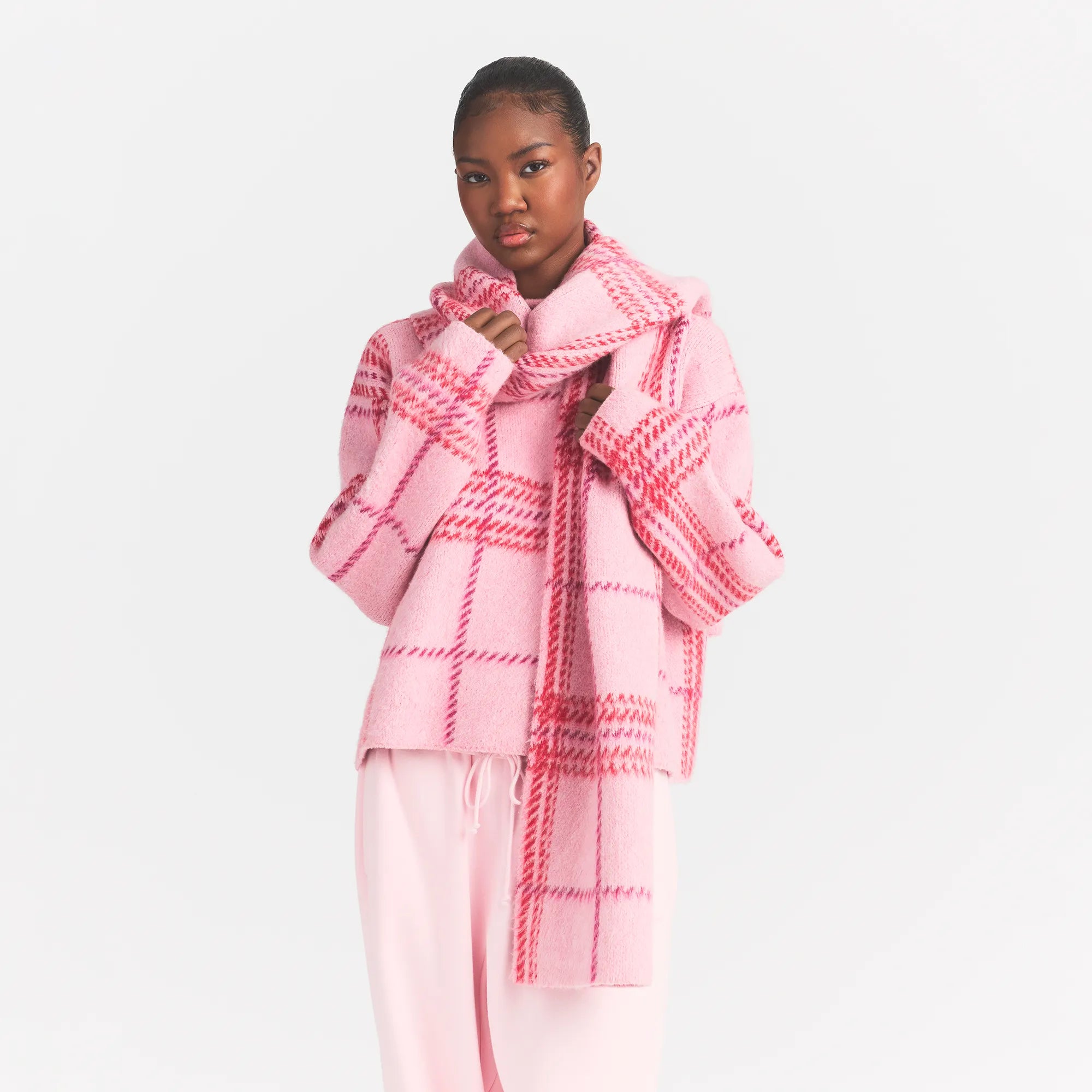 BRUSHED PLAID SCARF | PINK BIG HOLLY PLAID ON A MODEL FRONT VIEW @ | FOCUS: 0.0, 1.0, 0.9