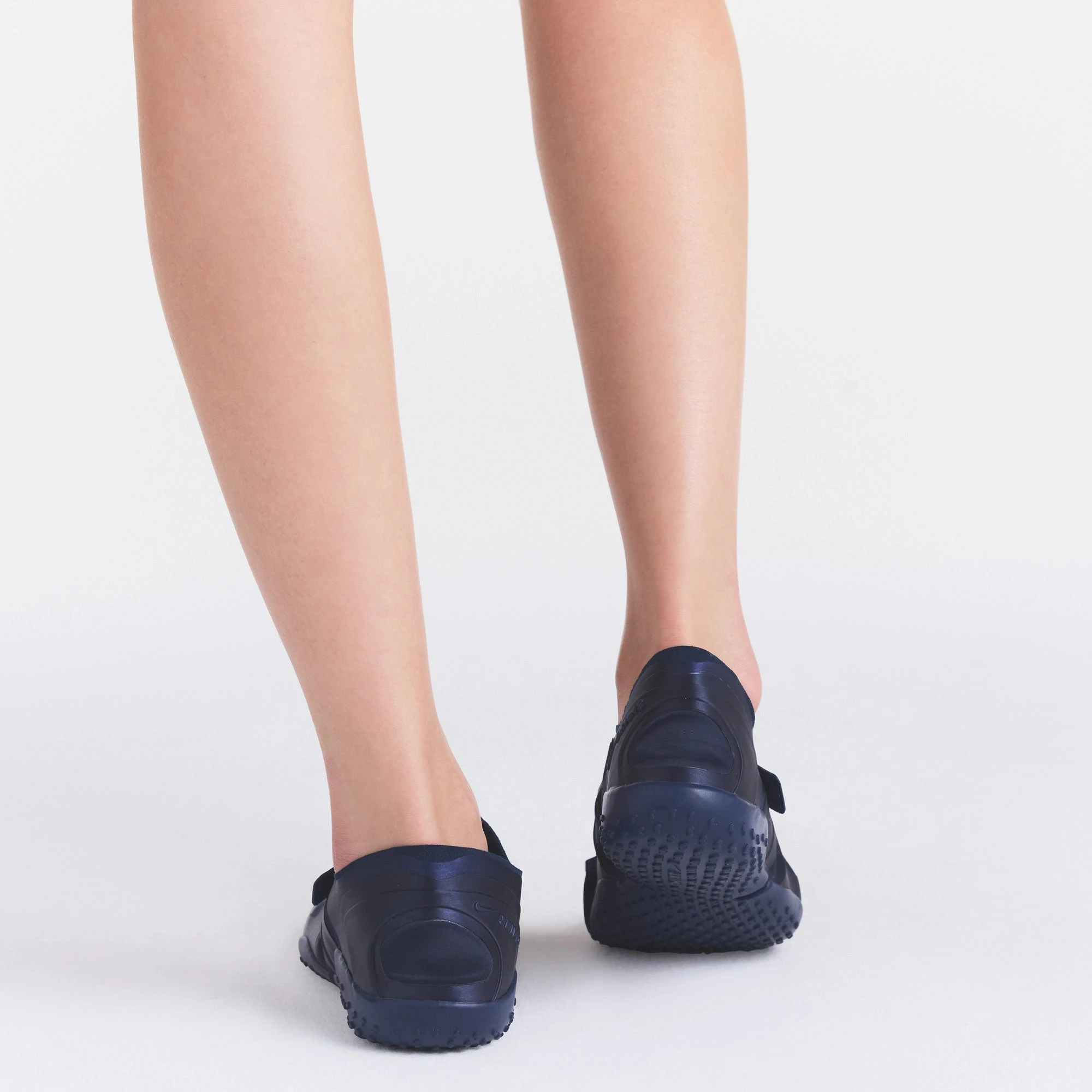 NikeSKIMS FOOTWEAR RIFT SATIN | NAVY ON A MODEL SIDE VIEW @ | FOCUS: 0.0, 1.0, 0.9