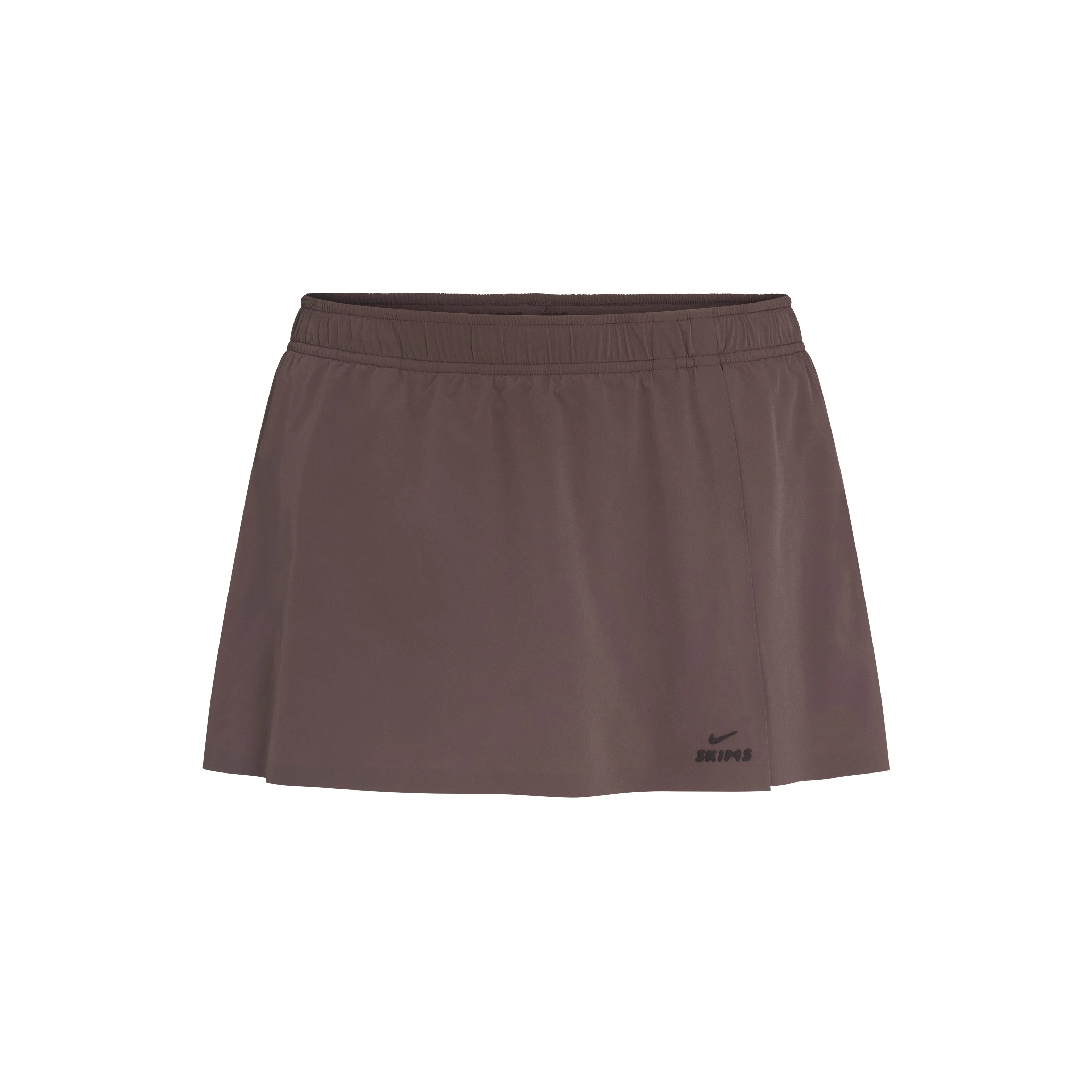 NikeSKIMS STRETCH NYLON FRONT FLAP SKORT | NSKM RESIN FLAT ON A WHITE BACKGROUND | FLT