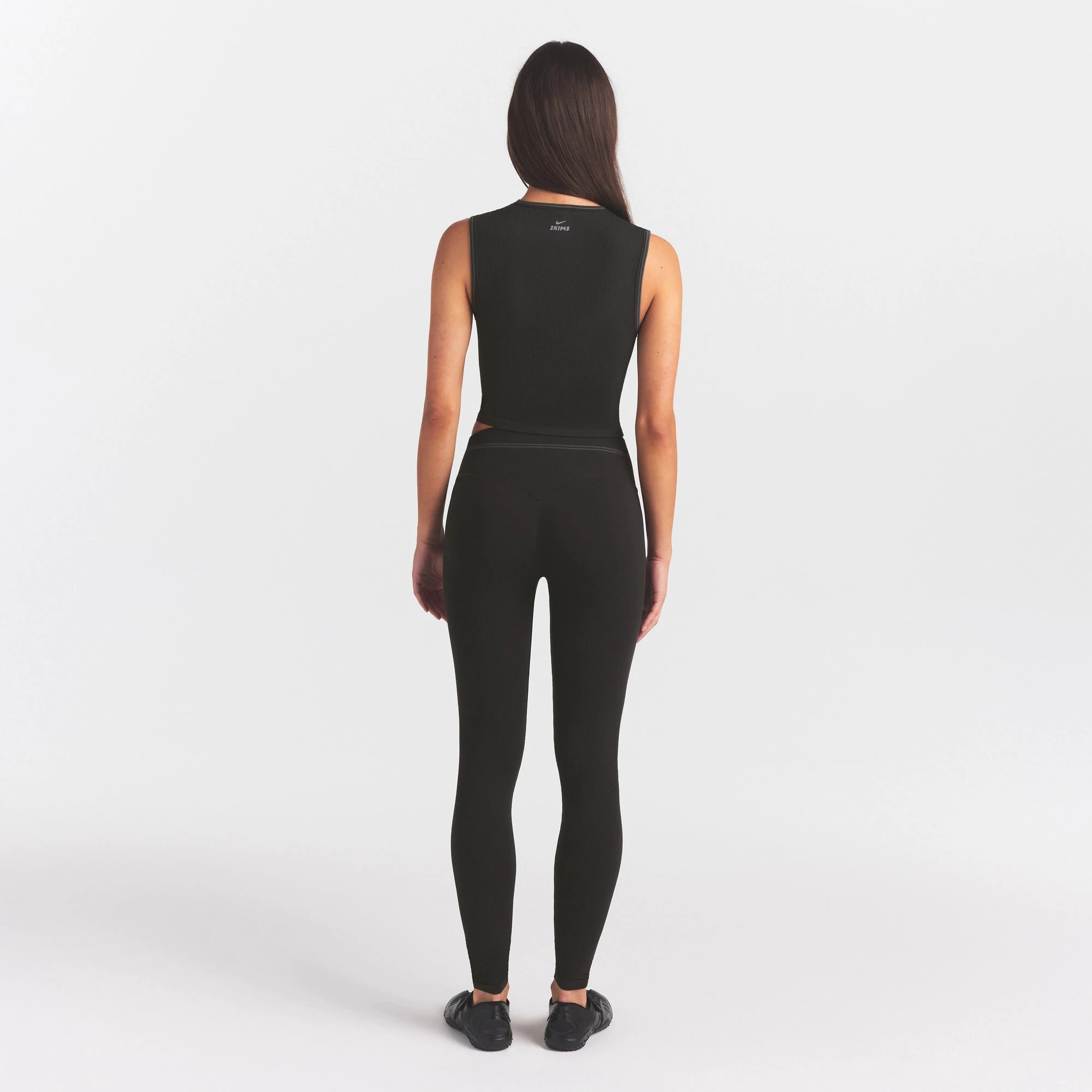 NikeSKIMS RIBBED SEAMLESS 26" LEGGING | OBSIDIAN ON A MODEL FRONT VIEW