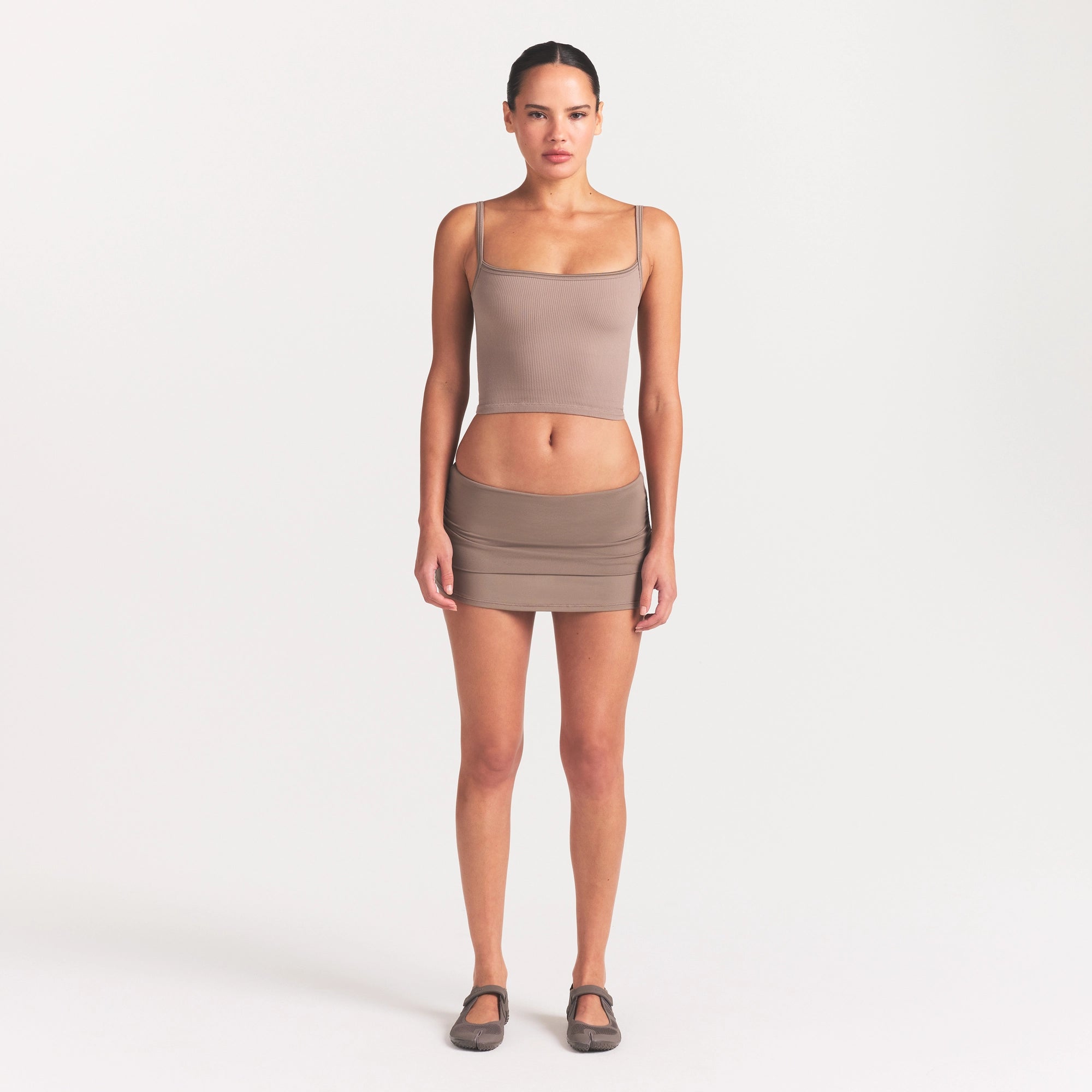NikeSKIMS AIRY FOLDOVER SKORT | DRIFTWOOD ON A MODEL FRONT VIEW @ | FOCUS: 0.0, 1.0, 0.9